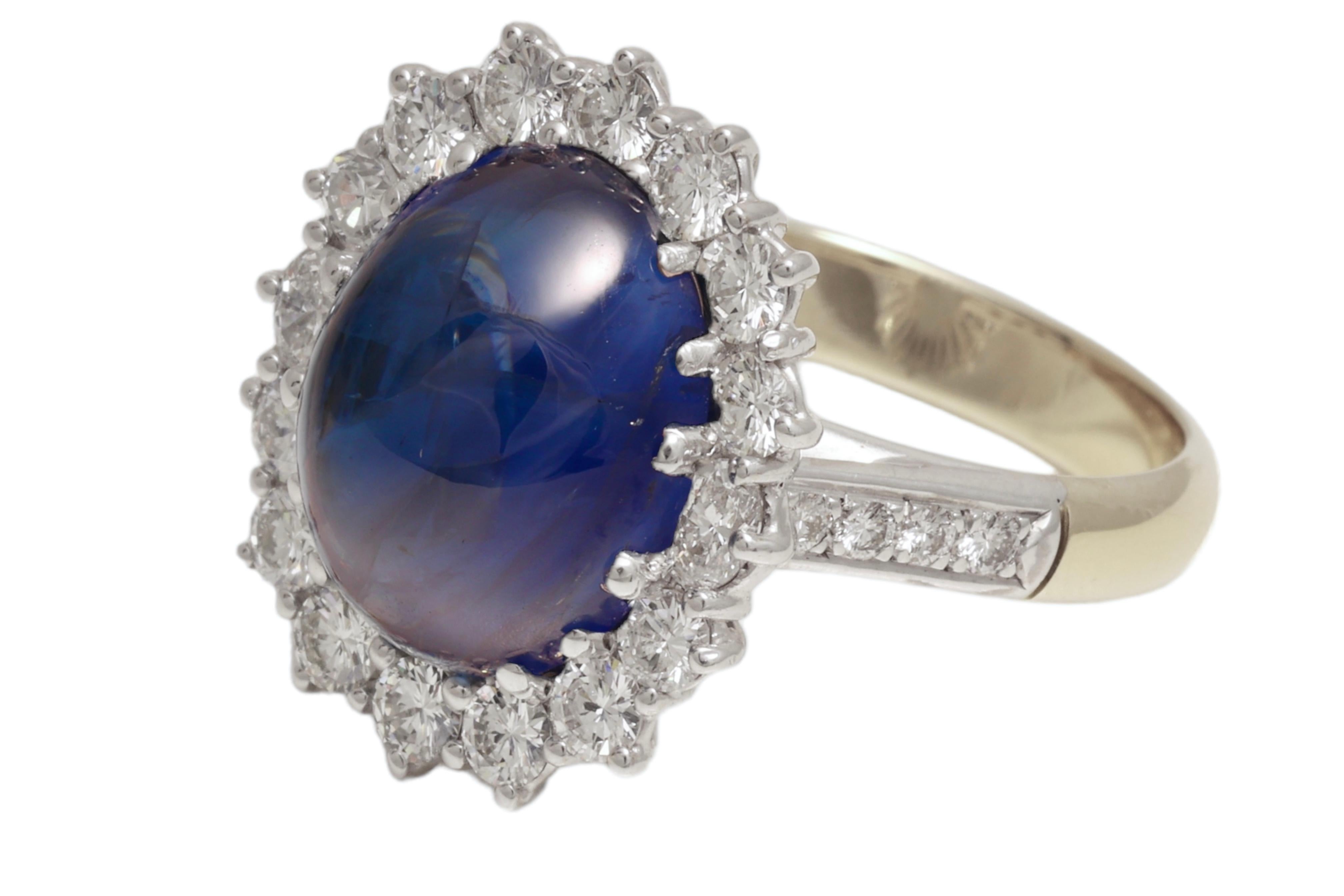 Gorgeous  18kt Yellow and White Gold Ring With a 9.93 Ct Ceylon Cabochon Sapphire & Diamonds 

Diamonds: Brilliant cut diamonds together approx. 1.80 ct. 

Sapphire: Intense blue, oval, Ceylon cabochon sapphire 9.93 ct. Comes with Carat Gem Lab