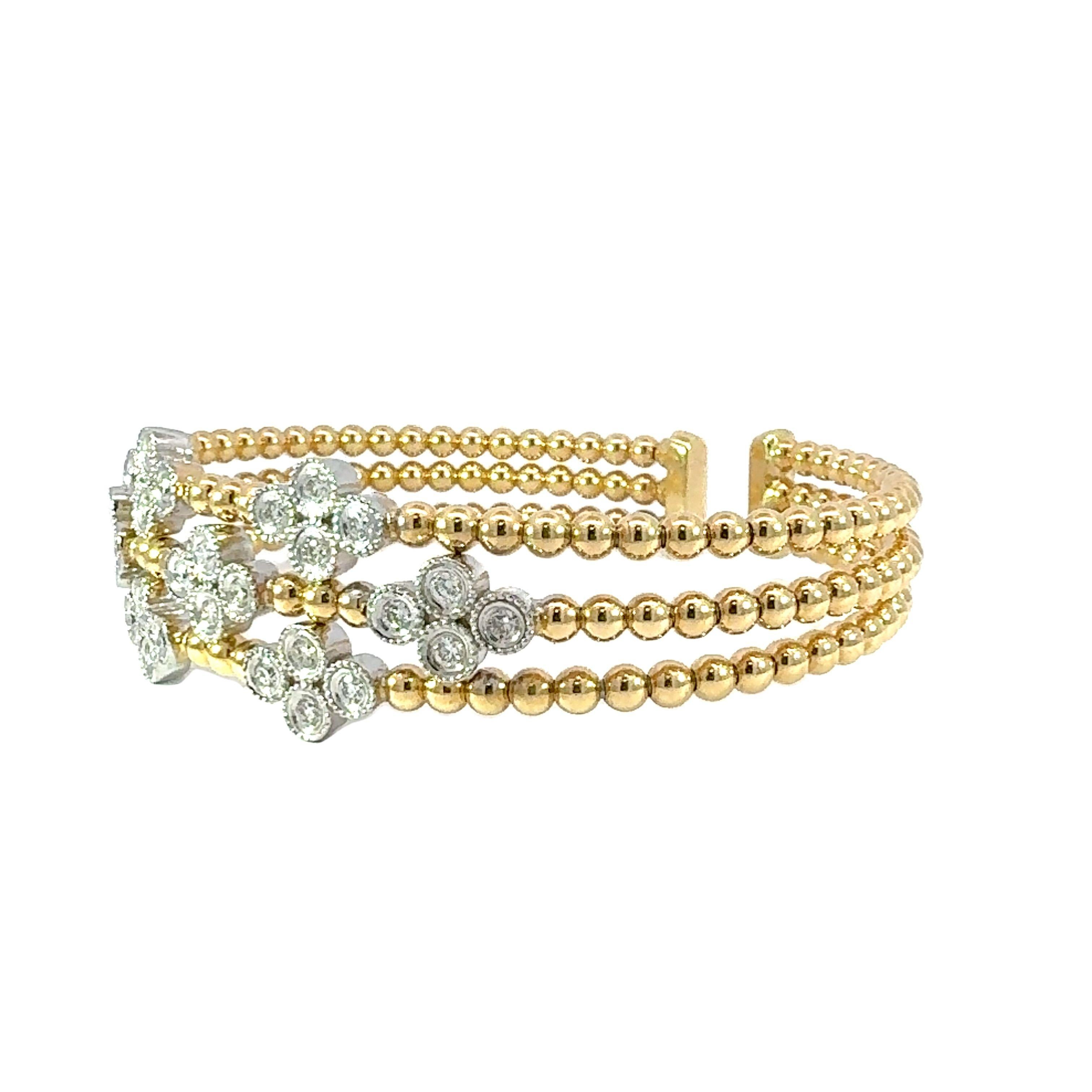 A stunning 18-Kt yellow gold solid diamond bangle made with 1.00ct natural diamonds. 

This stunning gold bangle is adorned with clusters of sparkling diamonds, making it stunning statement piece for every occasions. The delicate design combines