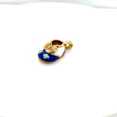 18KT YG Baby Shoe Charm with Blue and White Enamel with .02 Diamond and Bow