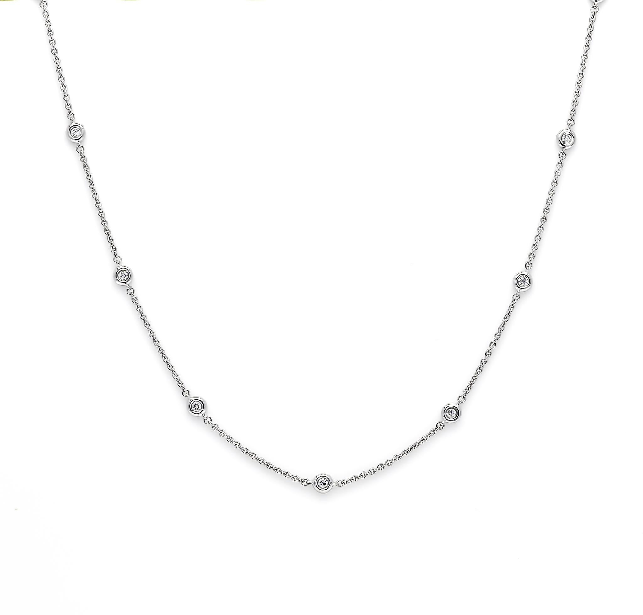Indulge in the epitome of luxury with our Dazzling Diamond Sparkle, captured with unparalleled elegance and enchantment in an 18 Karat White Gold Bezel Set Chain Necklace. This extraordinary piece showcases a resplendent round-cut diamond, weighing