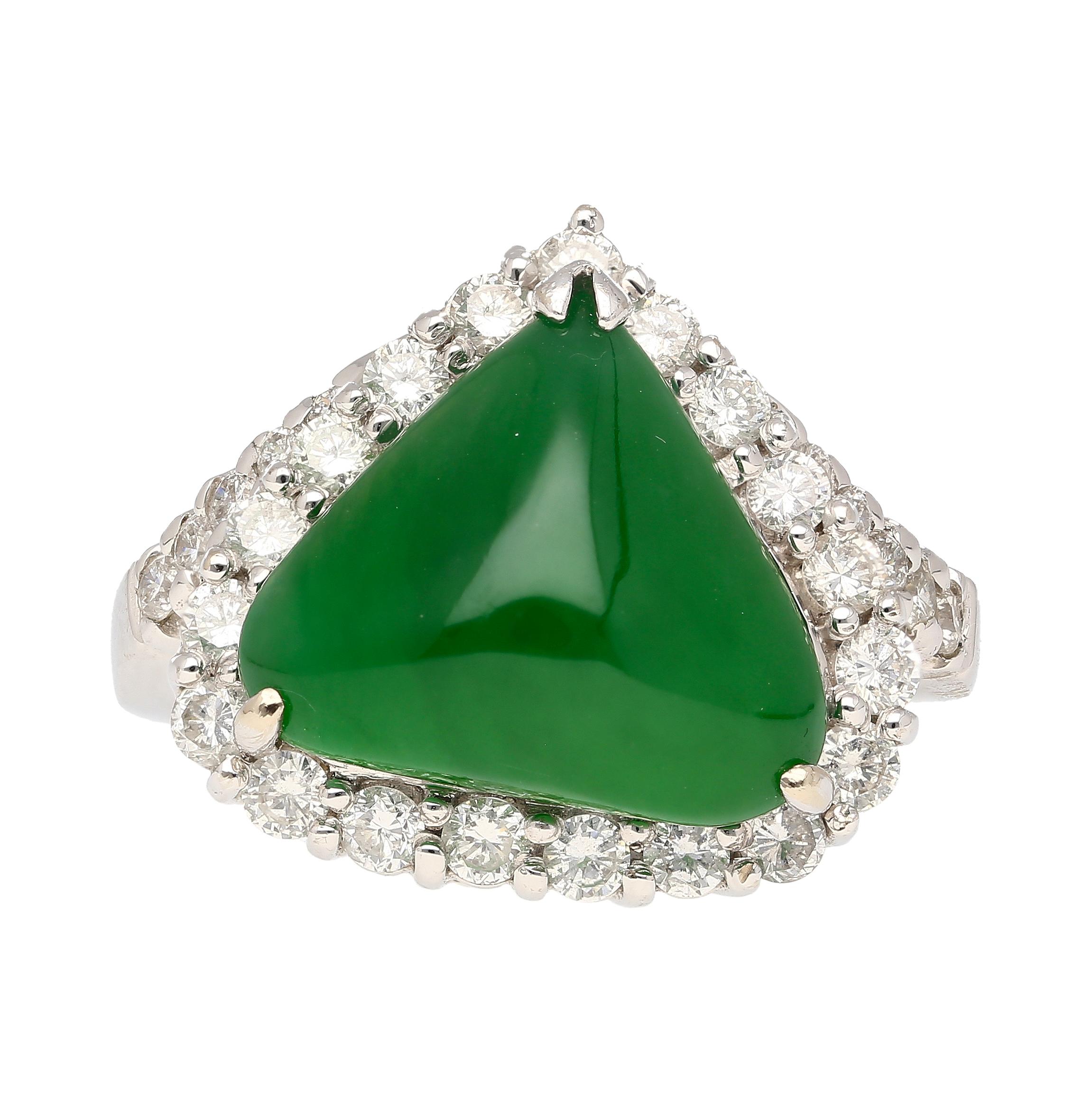 Cabochon Cut Kite/Triangle Shaped Type A Jadeite Jade in a 3-prong 18k white gold ring setting.

Featuring a prong-set Jade centerpiece embraced by a dazzling halo of diamond side-stones, this captivating masterpiece exudes timeless elegance and