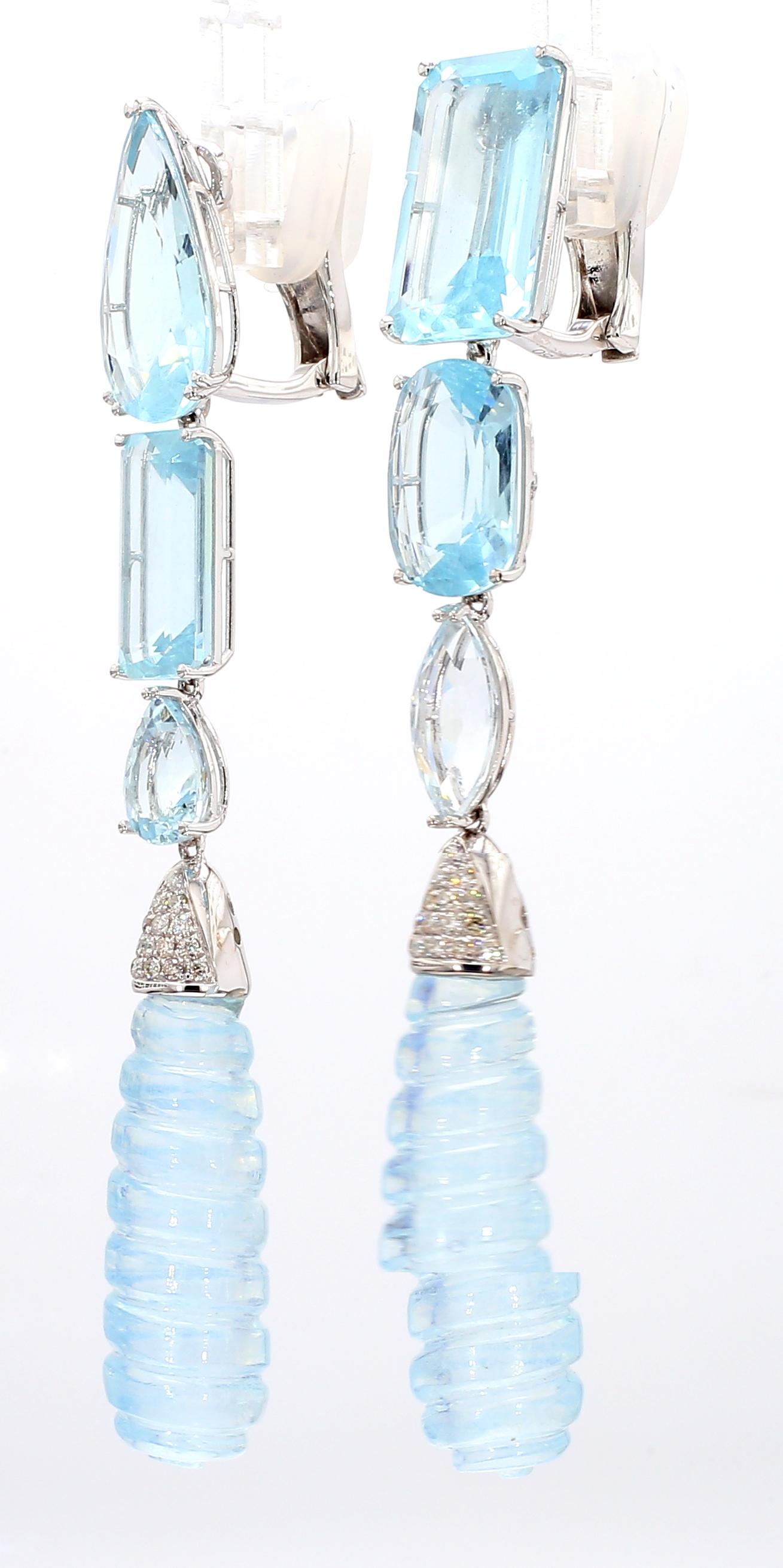 These 18KWG aquamarine and diamond drop earrings feature a stunning combination of fluted carved, pear-shape, emerald-cut, cushion, and marquise-cut stones. The further embellishment by 0.27 CTS of full-cut diamonds adds a touch of luxury. With a