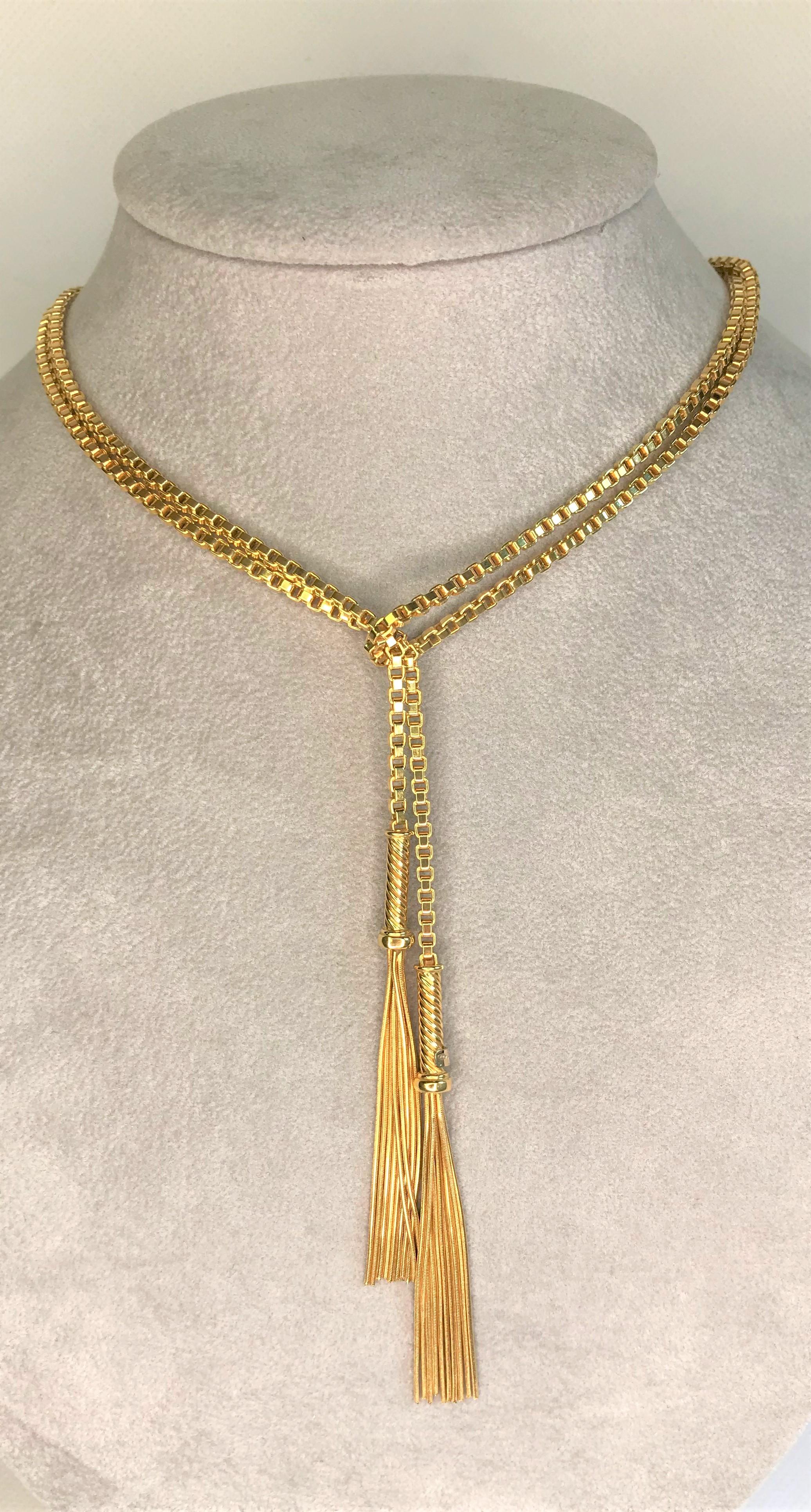Beautiful, versatile and unique- this is a must have!!
18 karat yellow gold 2.5mm box chain, approximately 48 inches long.  Can be worn long, doubled or even tripled.  It can even be worn as a belt!
Tassel with decorative connector on each end.
18