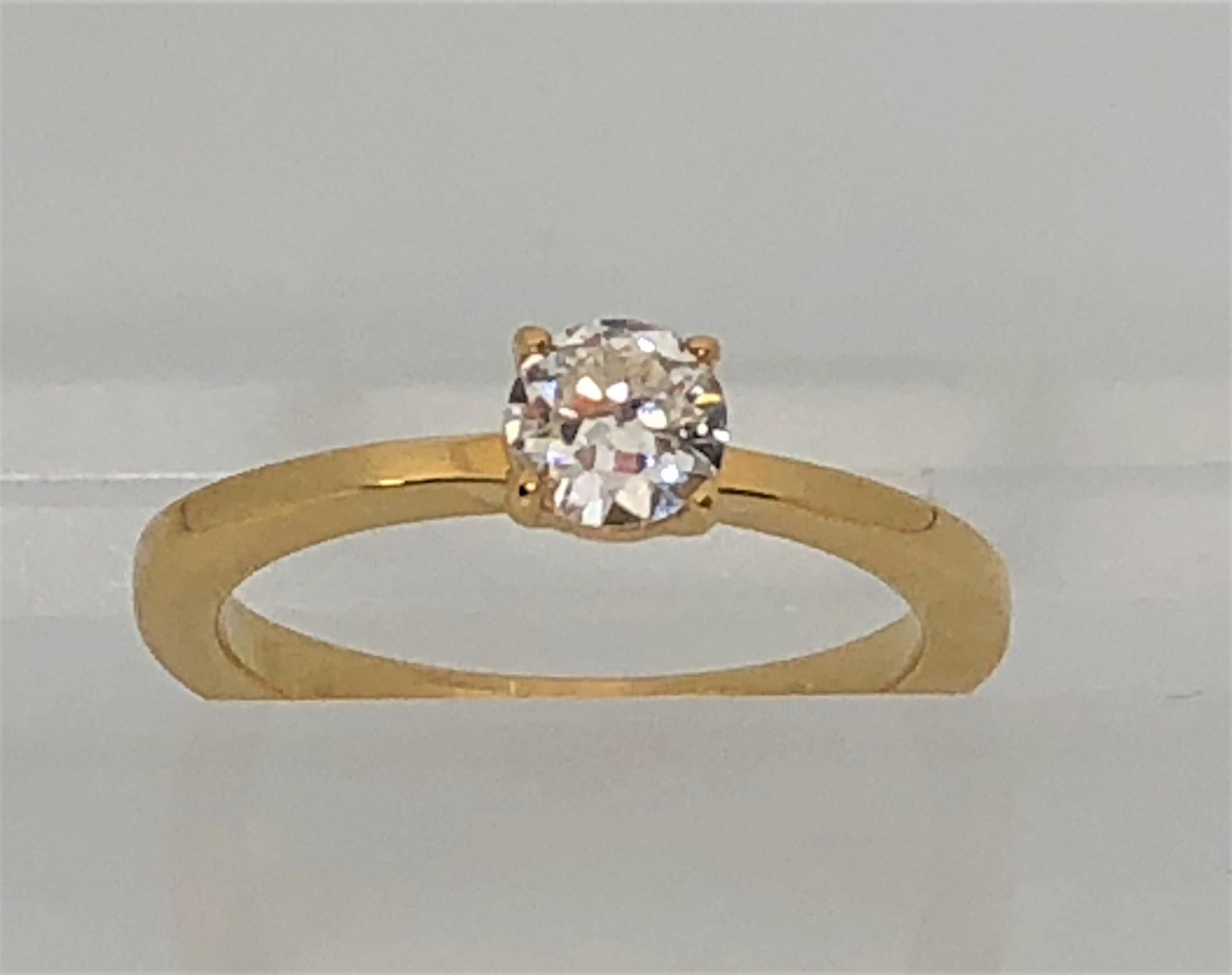 This ring sparkles from across the room!  A true classic. 
18 karat yellow gold band with beautiful prong set round diamond.
Diamond is approximately .36tdw.  G-H color, VS2-SI1 clarity.
Band is approximately 2mm wide
Stamped 