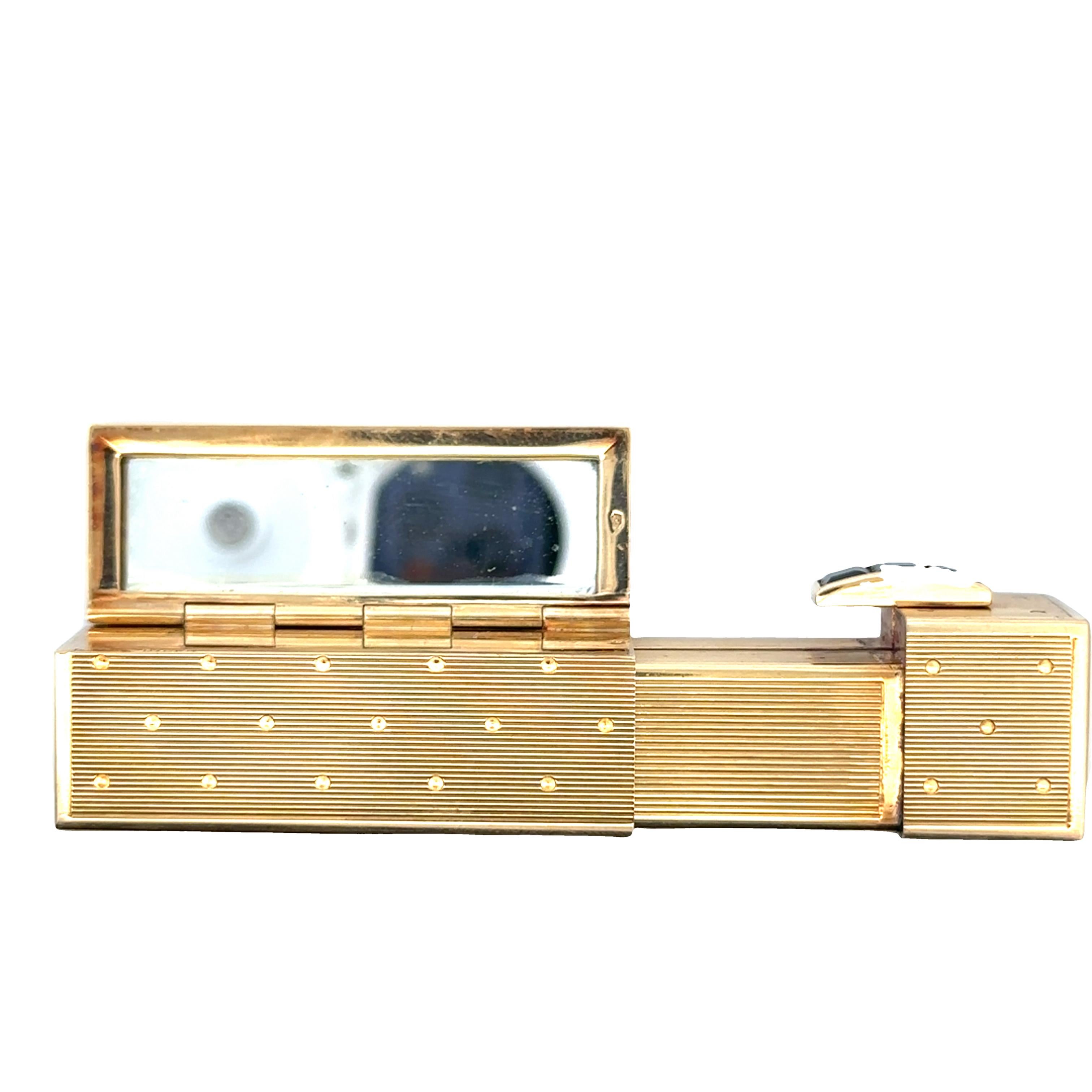A unique and charming Retro sapphire and gold lipstick holder created by Keltz Bloch. This vintage piece of jewelry is not only a functional accessory but also a testament to the style and craftsmanship of its time.

Keltz Bloch was a renowned
