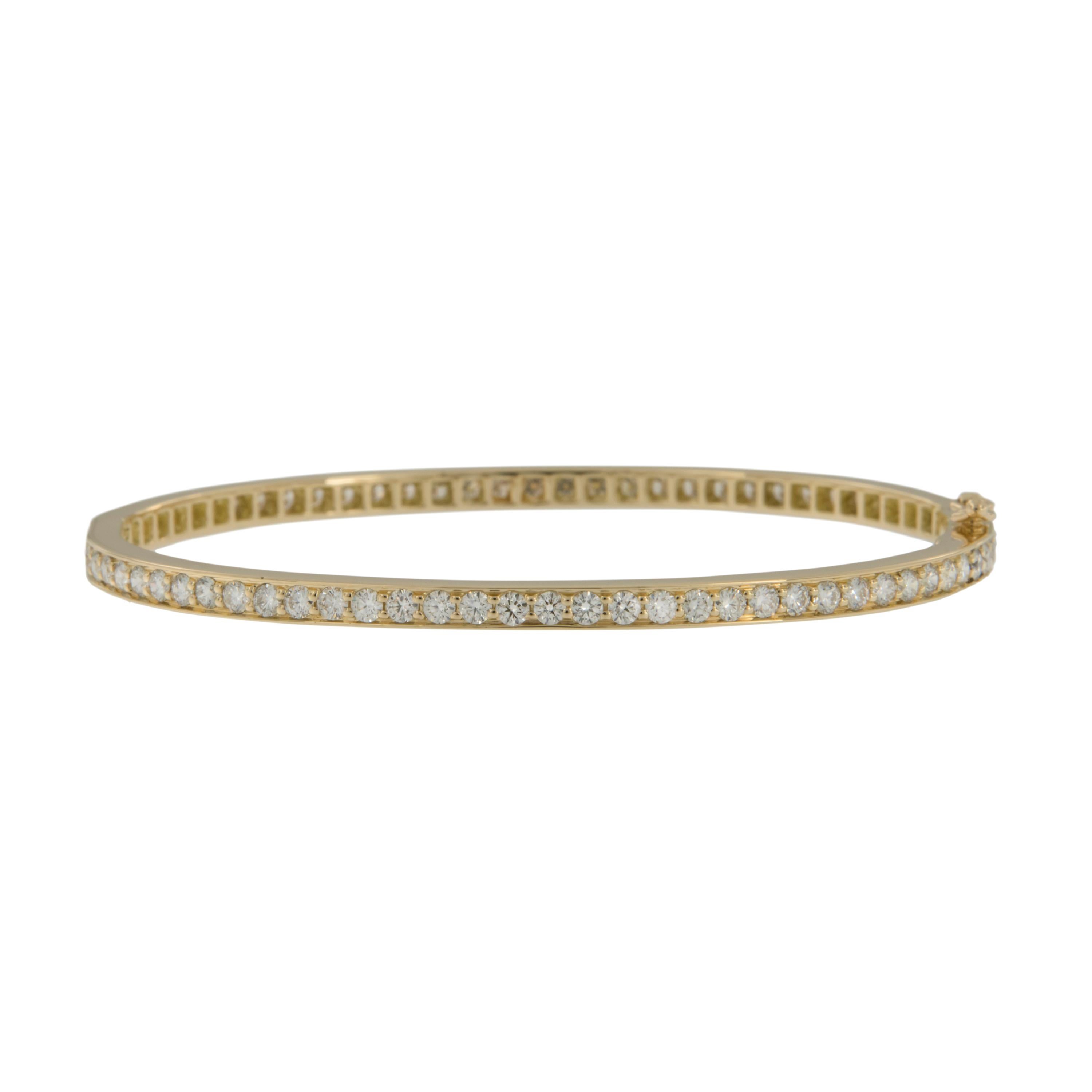 Why have it half way when you can have it all the way!? This timeless diamond bangle is unique in that it's 2.86 Cttw of fine diamonds (F - G, VVS-VS1) are set eternity style, going all the way around for the owner that deserves it all! Bracelet is