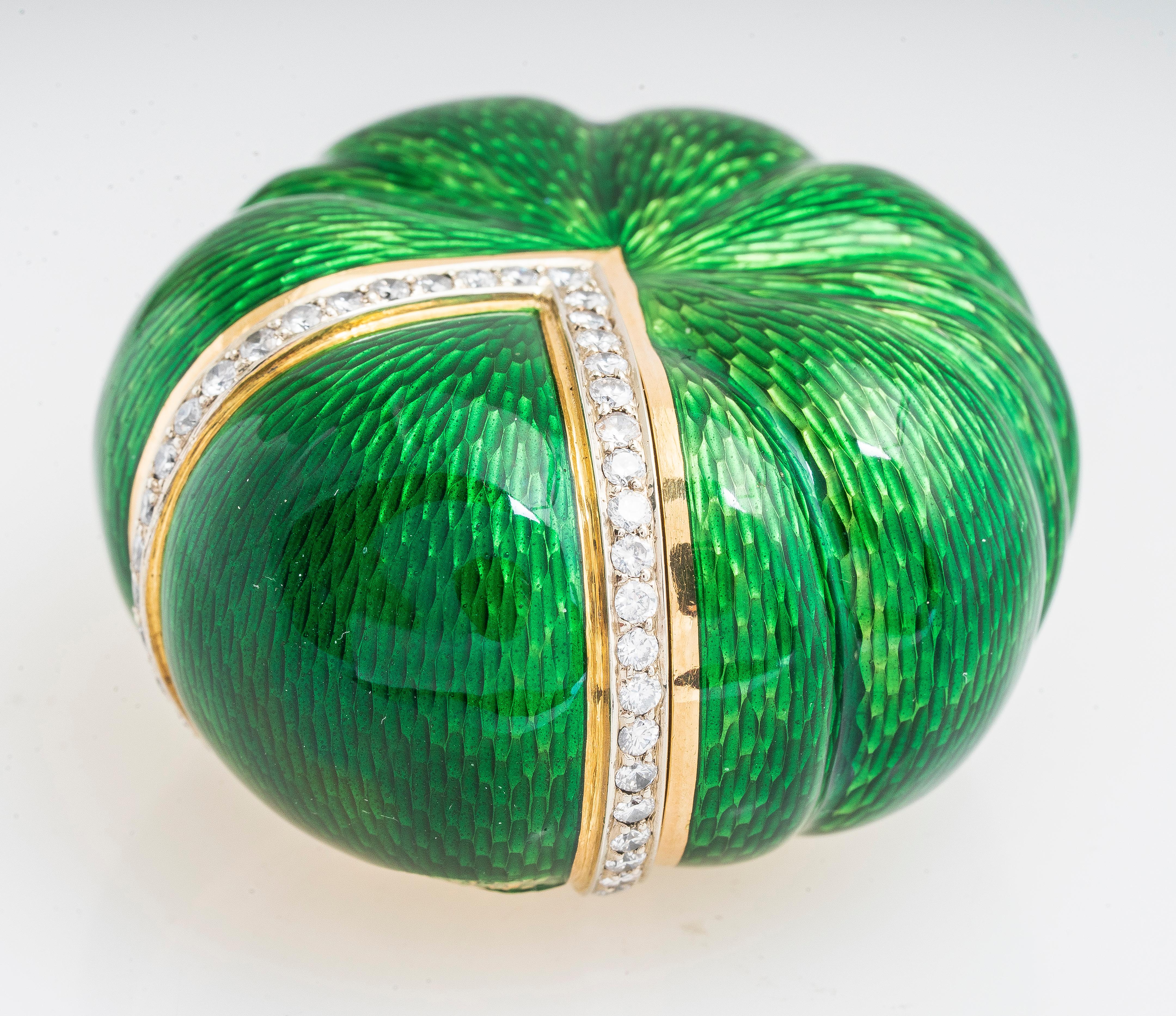 Vintage 18ky gold and diamond shell or pumpkin shaped pill/snuff box with green enameling.  Has 0.78 carat total weight of RBC diamonds H-I color and SI2-I1 clarity.  Besides the enamel that is worn off at the base of the V, the box is very well