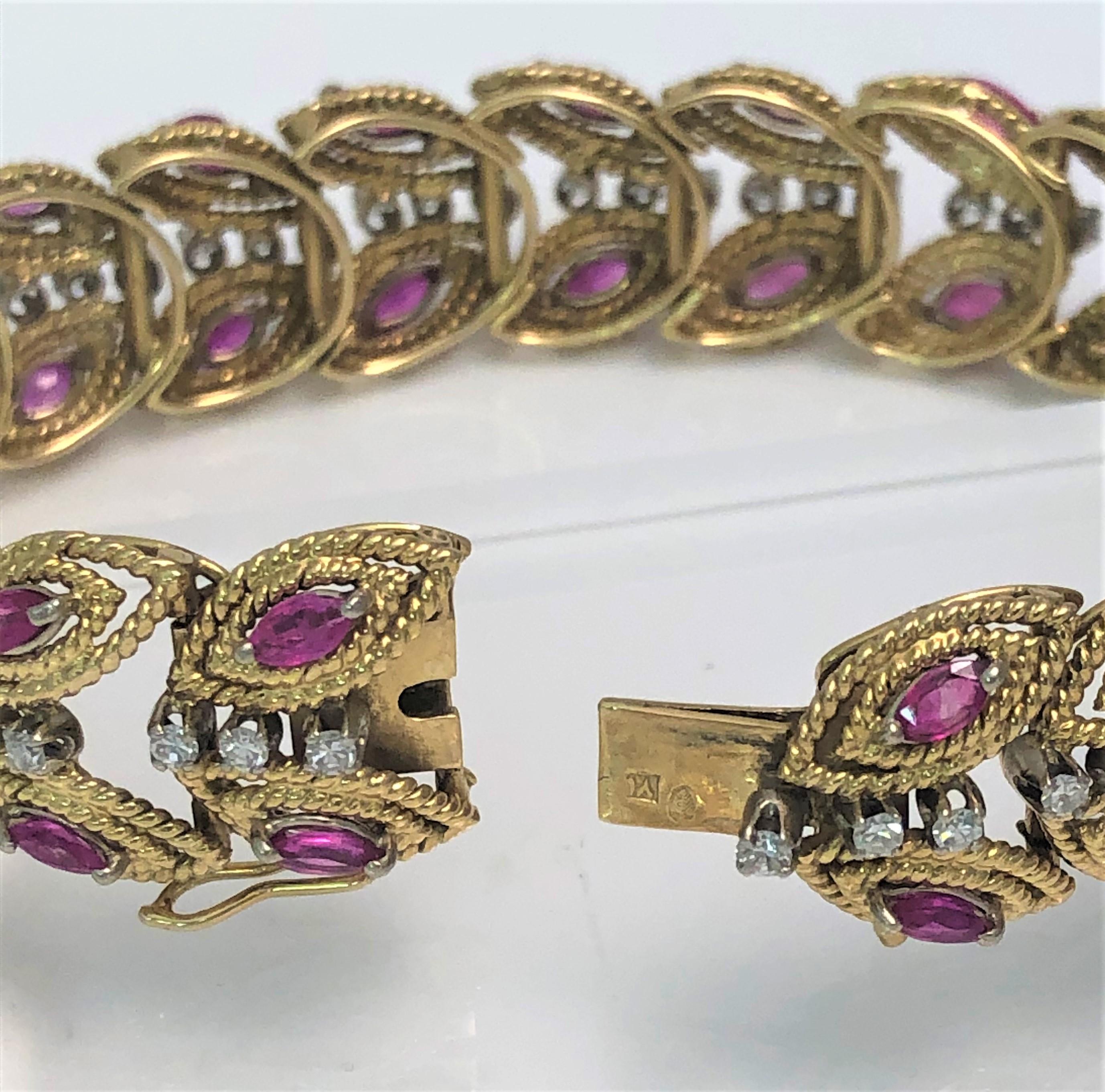 One-of-a-kind Beautiful Diamond and Ruby Bracelet.  This is sure to get noticed!!
18 karat yellow gold leaf design.
19 leaf stations, each including three round diamonds and two marquise rubies.
     57 round diamonds, approximately .05 each,