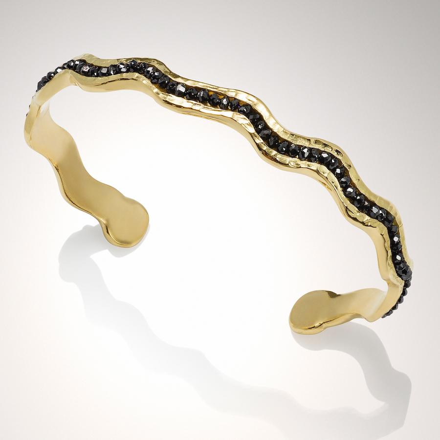 18KY Wave Cuff with Black Diamonds is a must have subtle statement cuff that can stand alone or be layered with other cuffs.  The Wave Cuff with Black Diamonds is part of the Wave collection of cuffs and rings.  Wave Cuffs are available with either
