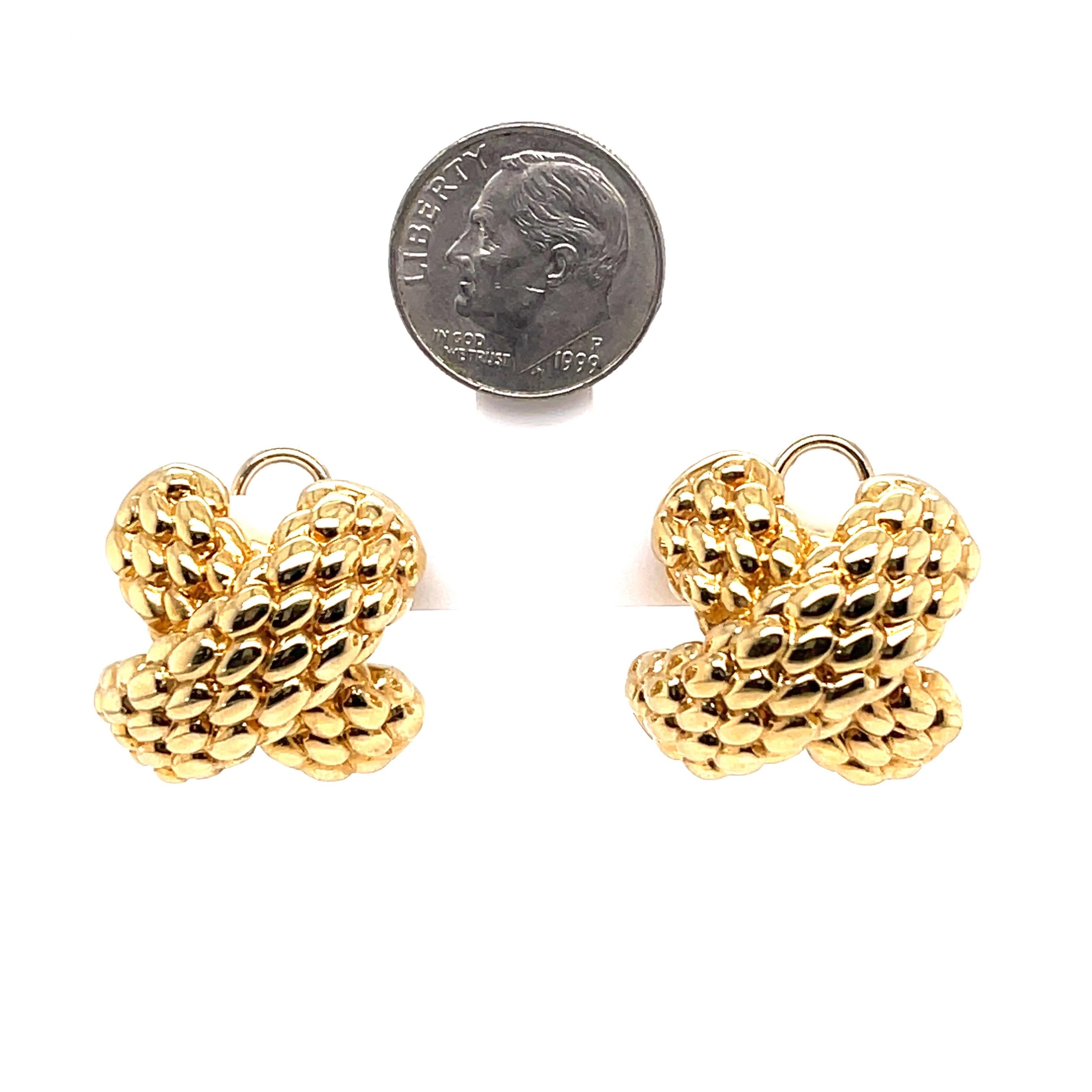 18 Karat Yellow Gold earrings featuring an X design in a textured motif weighing 11 grams. Made in Italy