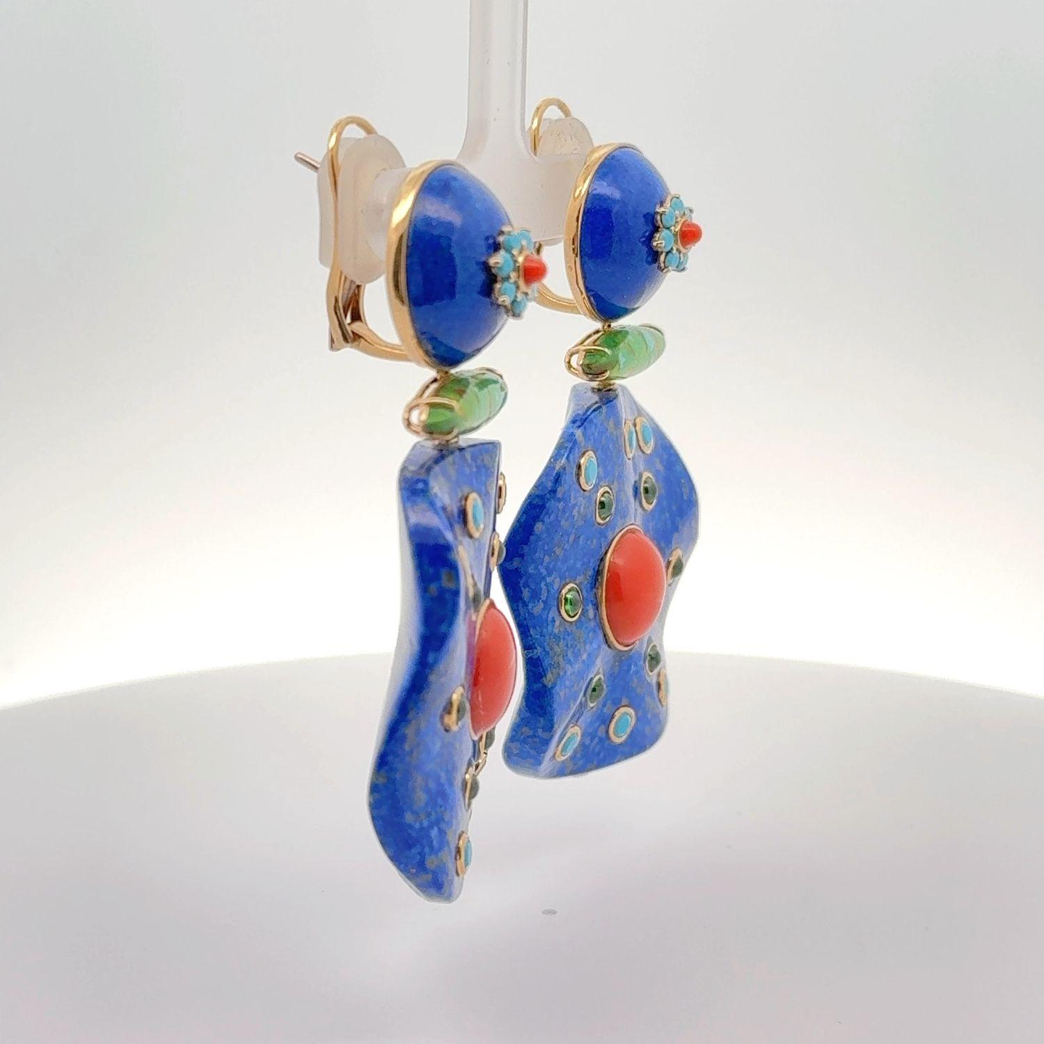 The earrings are made of 18K yellow gold, which gives them a rich, warm glow that enhances any outfit. They boast a stunning color palette featuring lapis, turquoise, coral, green quartz, and chrysoprase. Each stone adds a unique hue, creating a