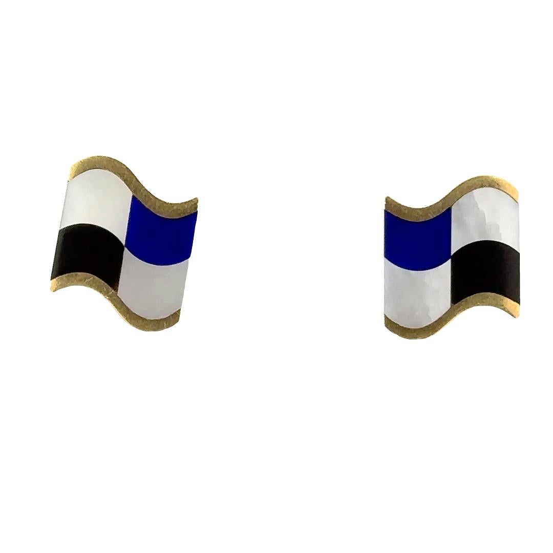 An exquisite 18kt yellow gold Tiffany & Co. vintage earrings designed by Angela Cummings. These distinctive earrings showcase a patriotic flair, shaped like a flag and adorned with lapis, onyx, and mother of pearl elements. Angela Cummings, an