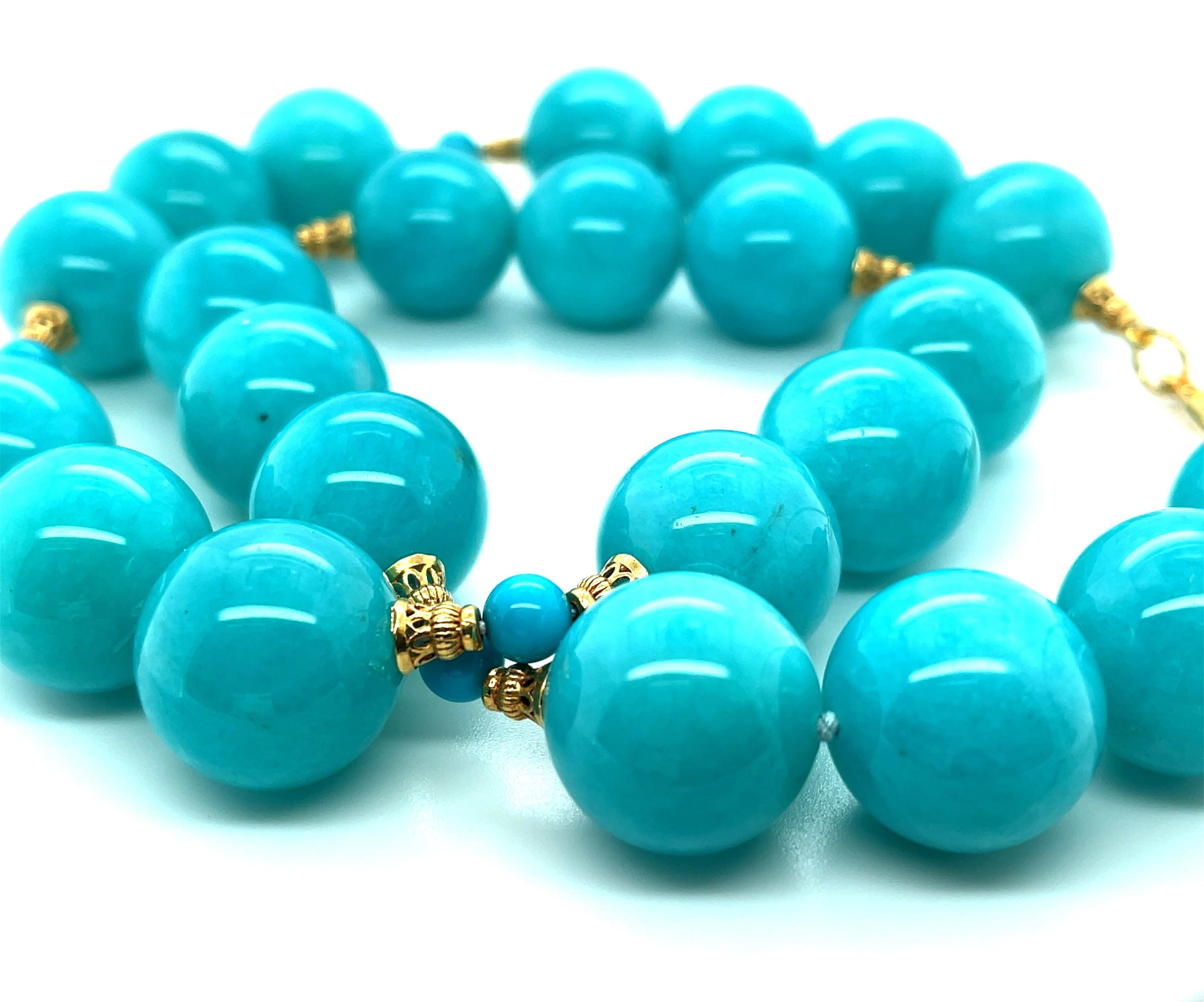 This stunning statement necklace features a beautiful collection of perfectly matched, 18mm round amazonite beads with vibrant, gorgeous color! The large amazonite beads are paired with smaller turquoise beads and decorative 18k yellow gold