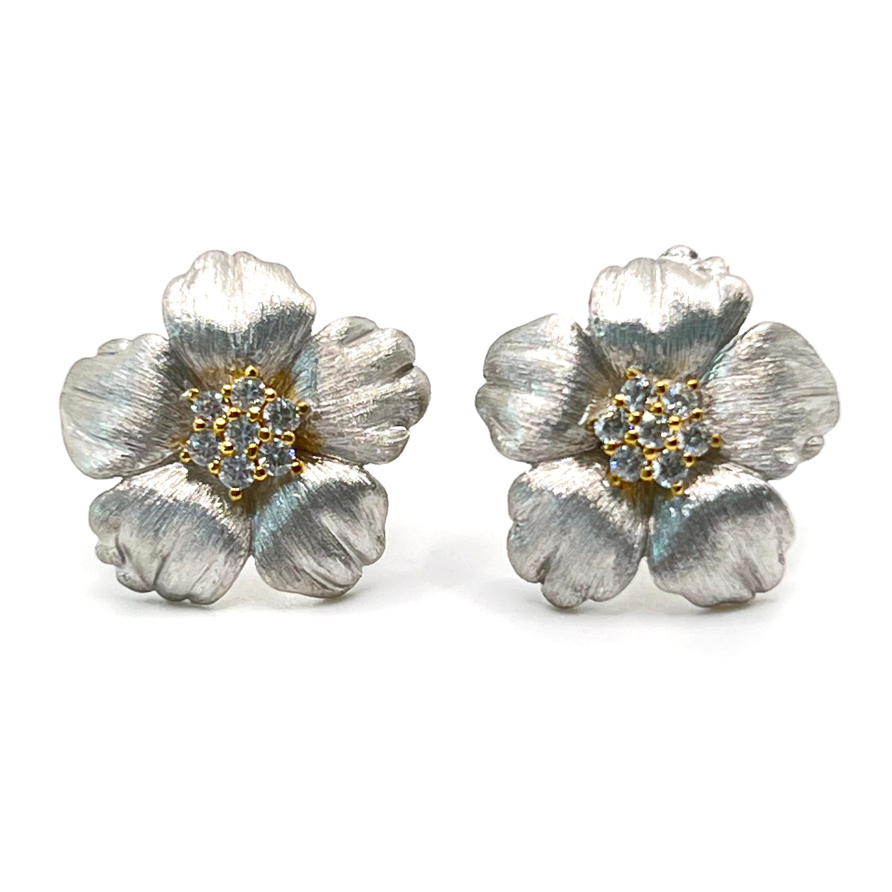 Elegant 18mm Five Petal Flower Two-tone Sterling Silver Earrings

This stunning pair of earrings features intricate design three dimension five petal flower, adorned with round simulated diamond cz, handset in two-tone platinum rhodium and 18k
