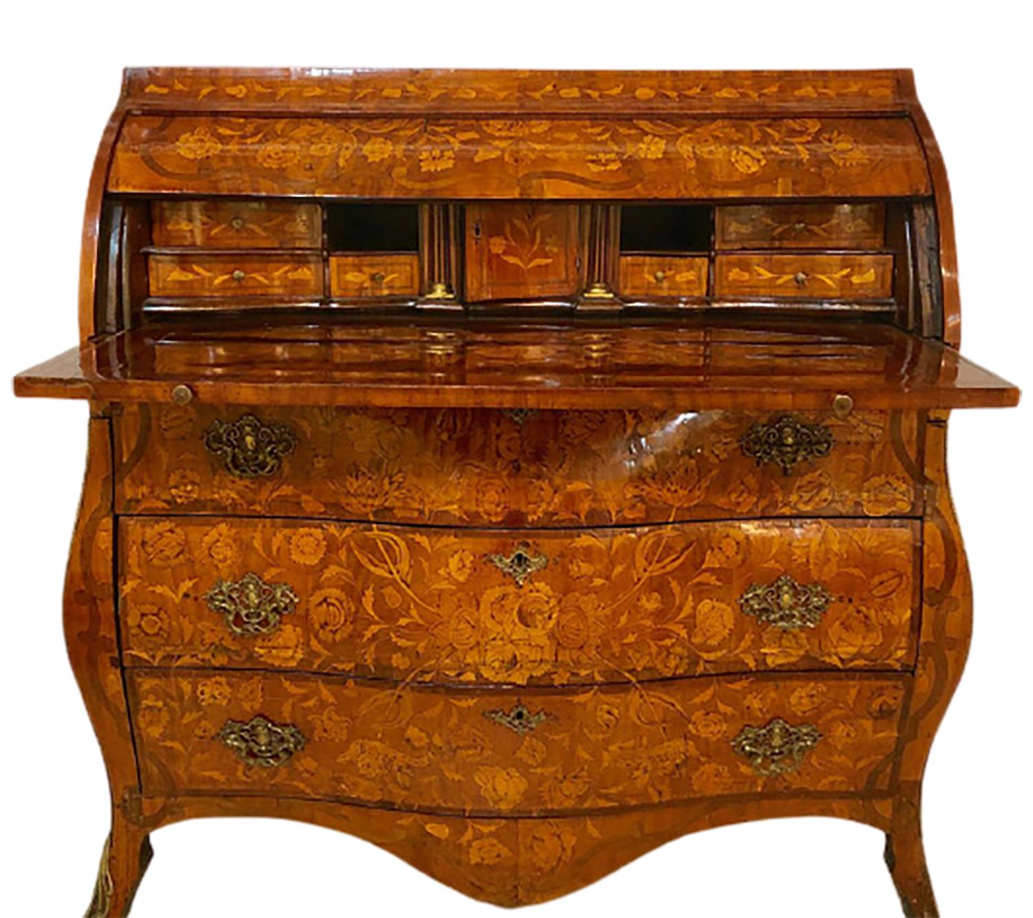 18th-19th century Bombay Dutch marquetry cylinder desk. Having an open desktop that measure 18.75 inches in depth and 41.5 inches in width, this stunning work of art can easily hold a lap top or full computer screen. The overall Bombay shape having