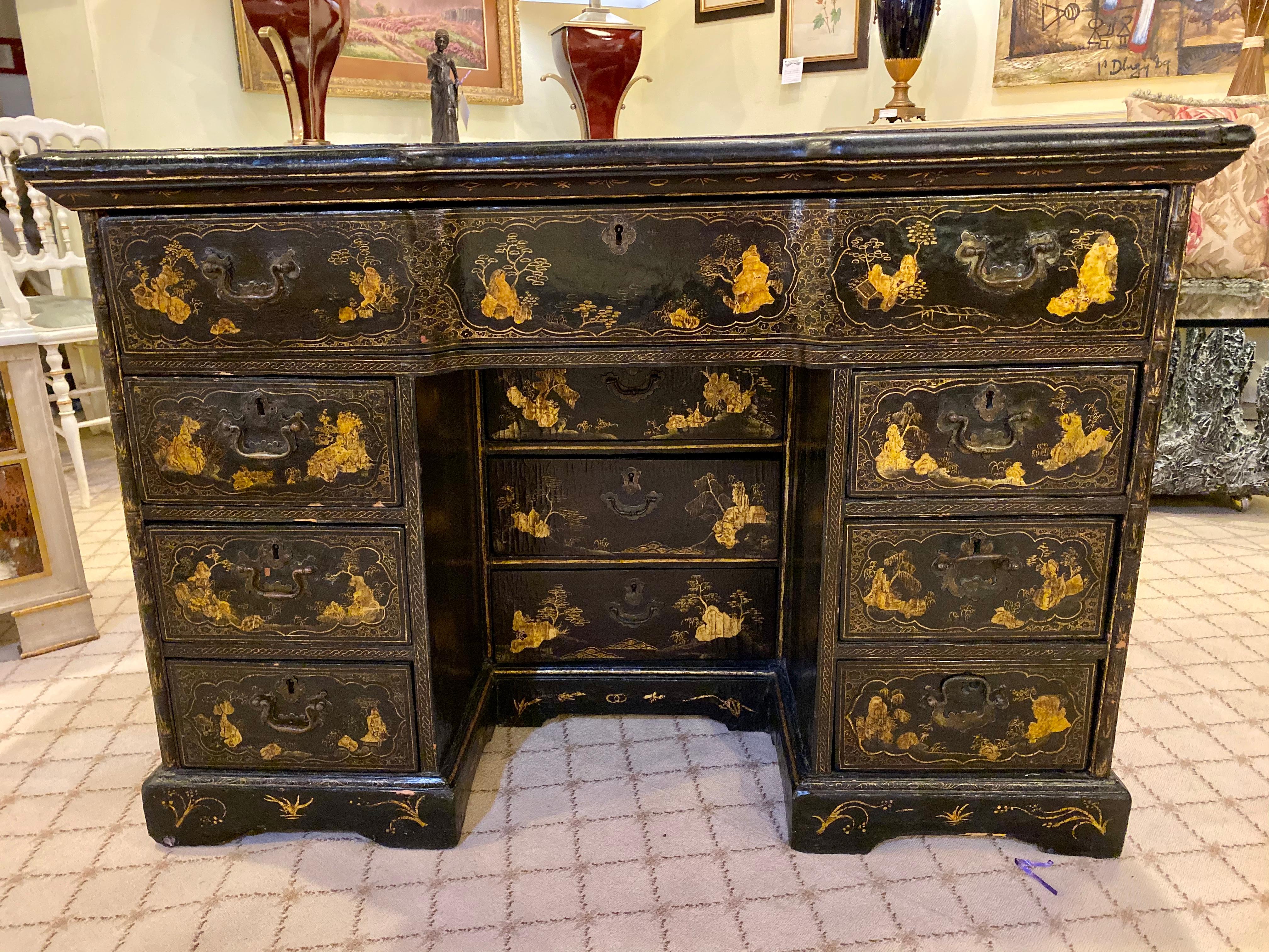 A wonderfully all over decorated Chinoiserie decorated knee hole desk. Decorated bracket Feet support the three central drawers flanked by a set of three matching drawers under a large upper drawer. The top and sides all over decorated in the 18th