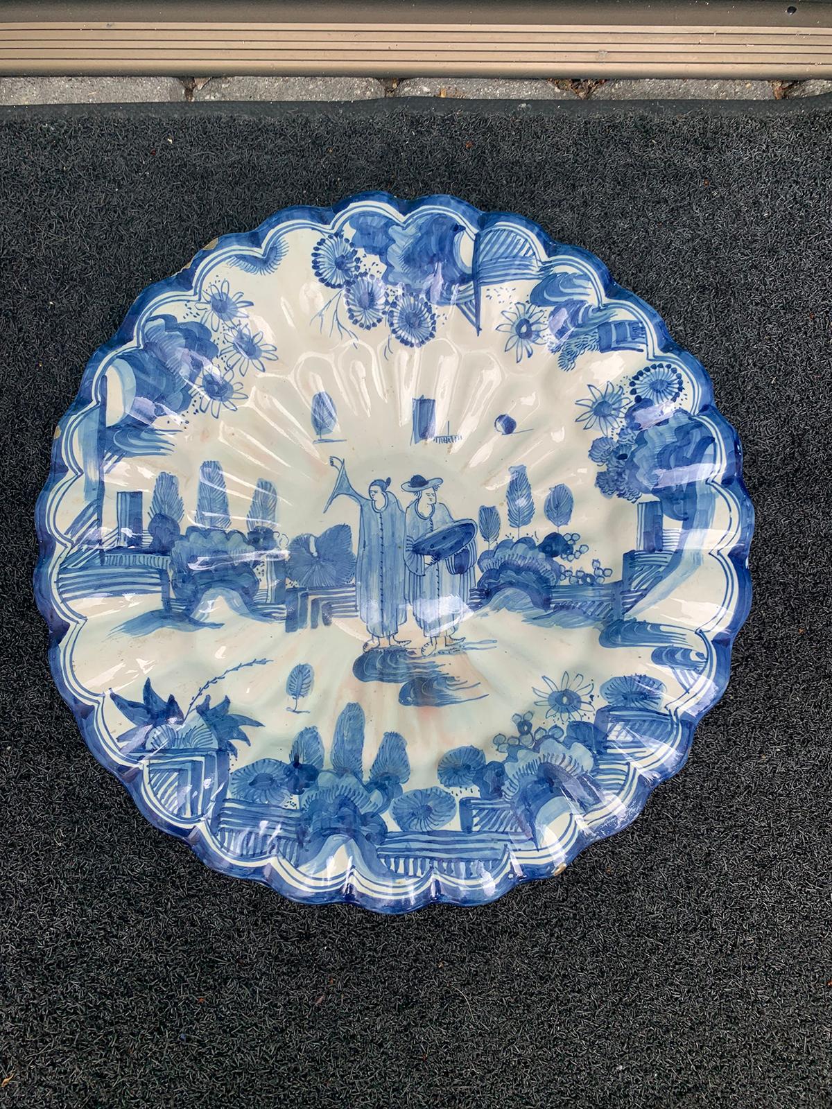 18th-19th century Dutch delft blue and white plate with scalloped edge, unmarked.