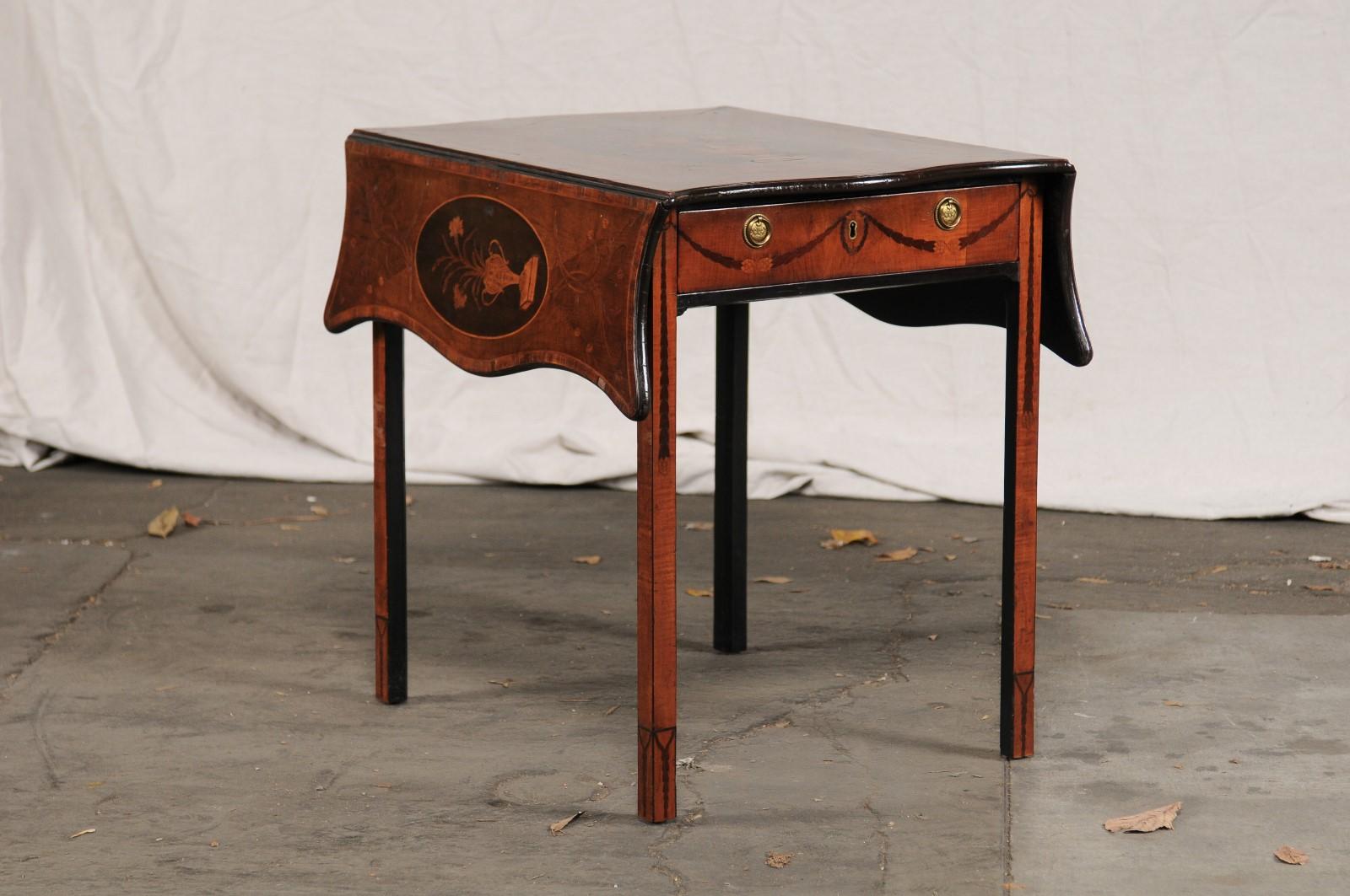 18th-19th century English George III mahogany inlaid pembroke table, Prince of Wales Feather Hardware, attributed to Mayhew & Ince.
Sycamore, tulipwood marquetry, ebonized
Measures: 38.5