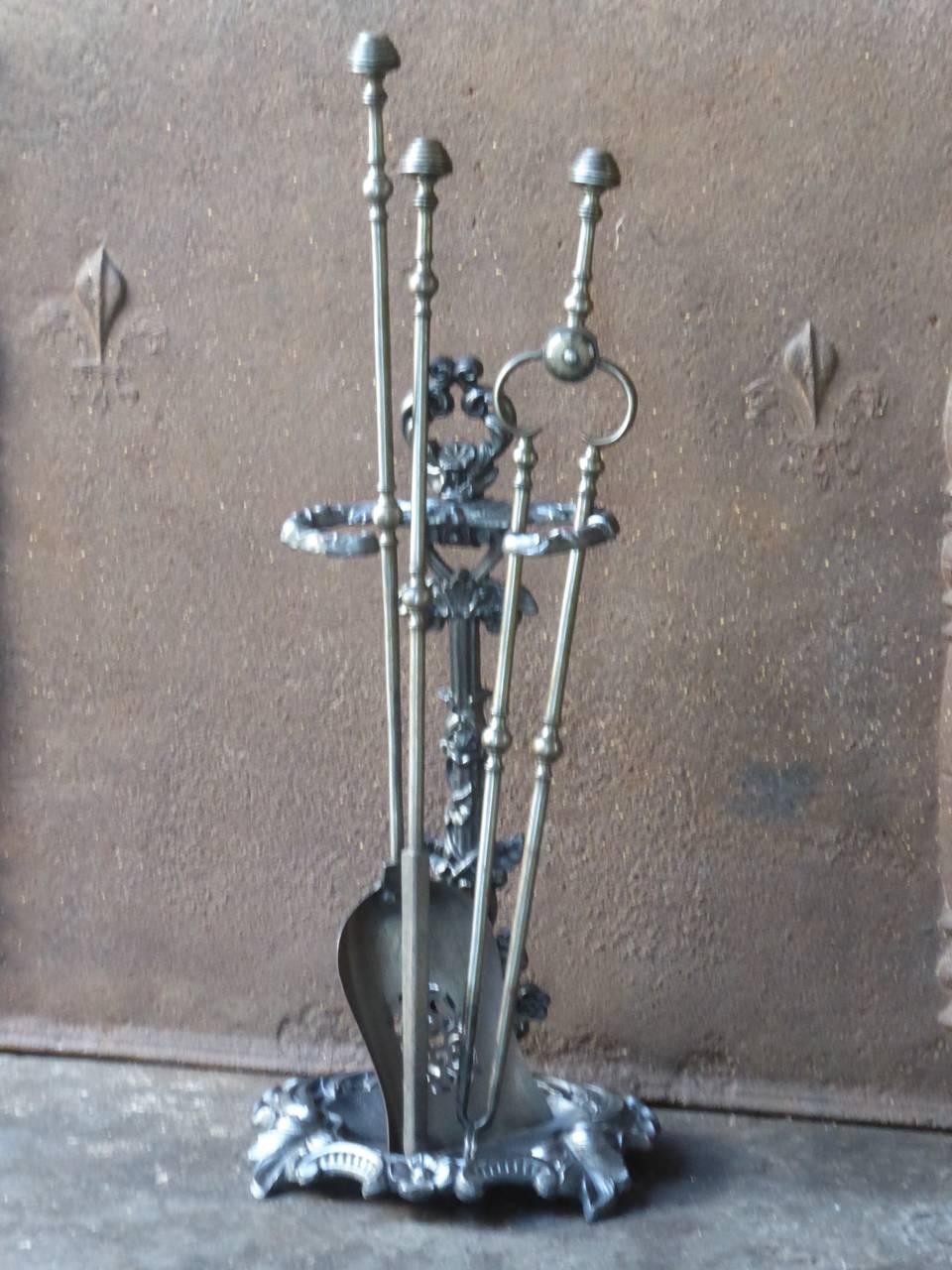 18th-19th century English fireplace tool set - fire irons made of cast iron and wrought iron. 
We have a unique and specialized collection of antique and used fireplace accessories consisting of more than 1000 listings at 1stdibs. Amongst others we