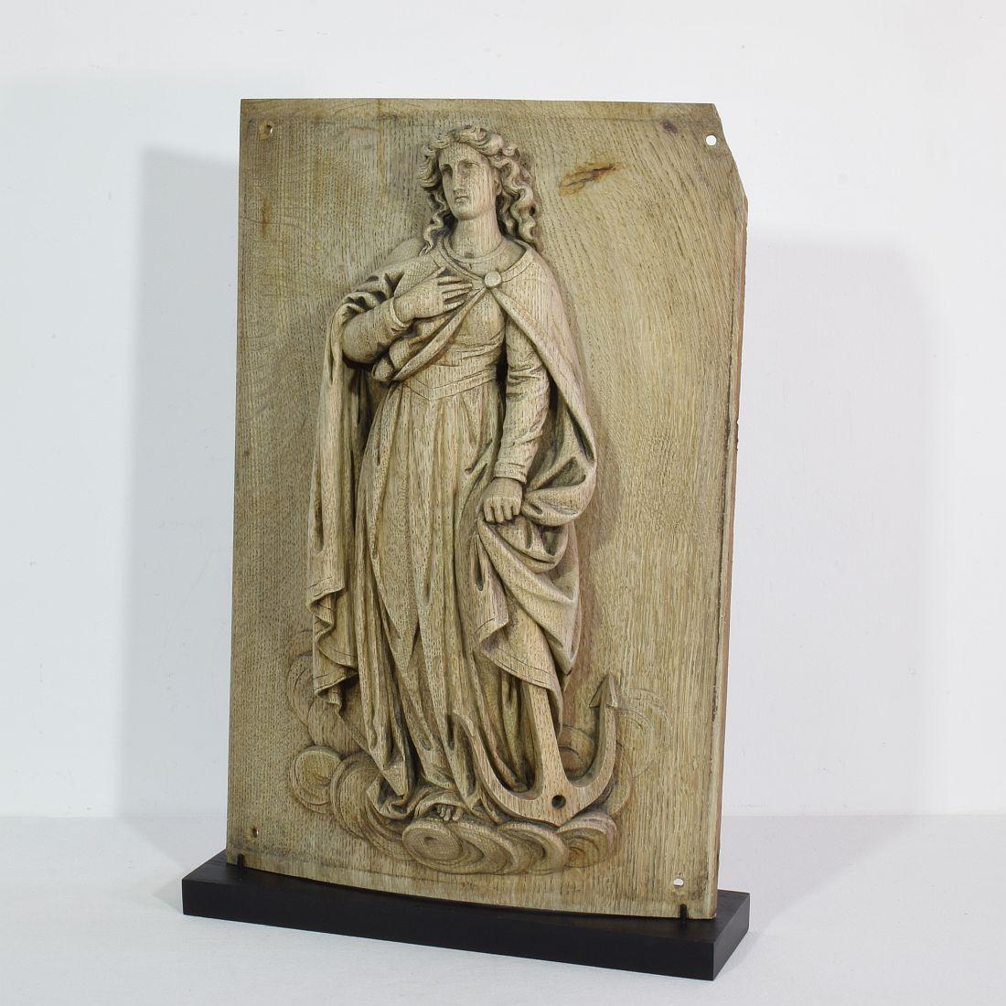 Beautiful weathered oak panel representing Saint Philomena.

Also known as Philomena of Rome was a young virgin martyr whose remains were discovered on May 24–25, 1802, in the Catacomb of Priscilla. Three tiles enclosing the tomb bore an