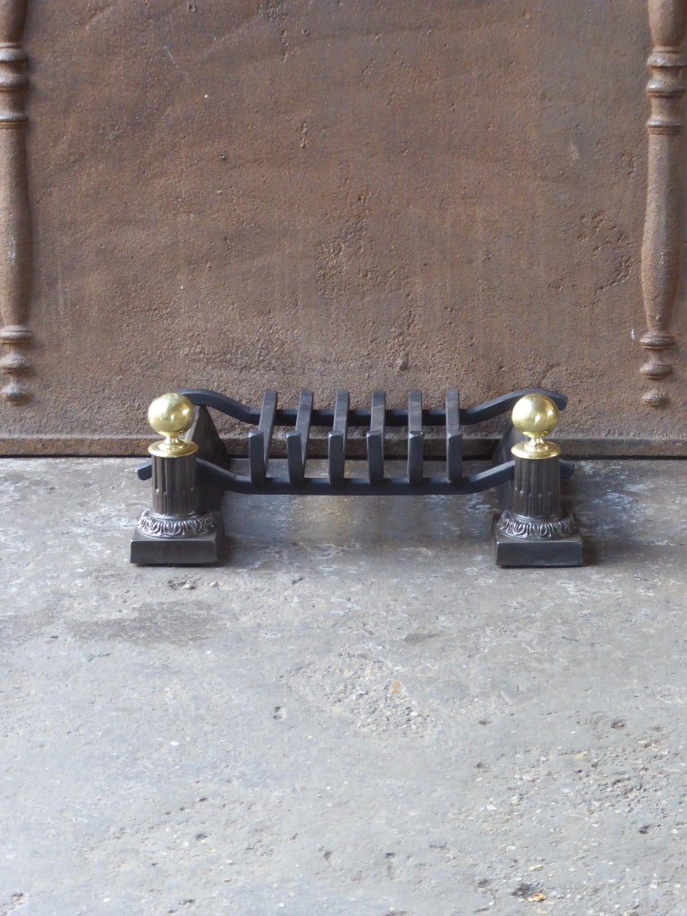 18th-19th century French neoclassical fireplace basket - fire basket made of cast iron, polished brass and wrought iron. The condition is good.