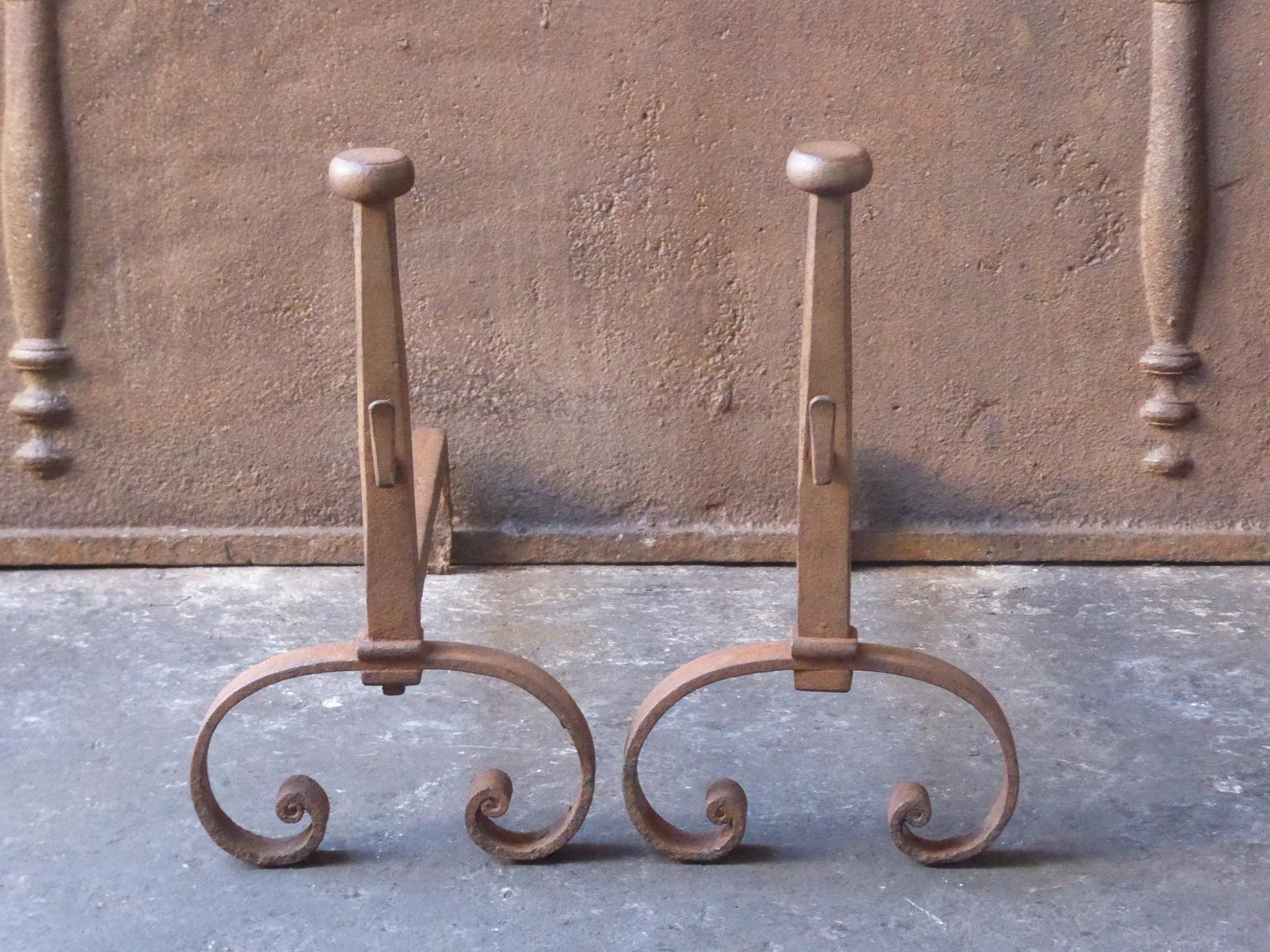 19th century French Louis XV style andirons made of wrought iron. The patina of the andirons is brown. Upon request it can be made black. The condition is good.







  