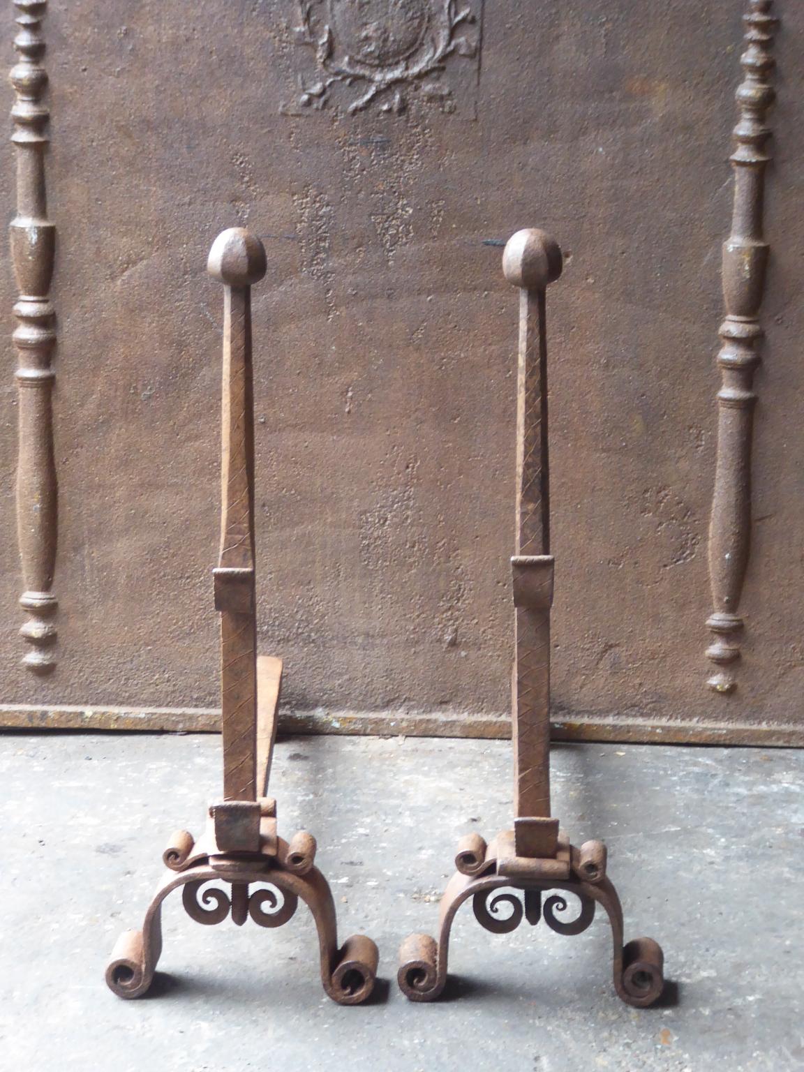 18th-19th century French Louis XV andirons made of wrought iron. The andirons have spit hooks to grill food. The condition is good.







   