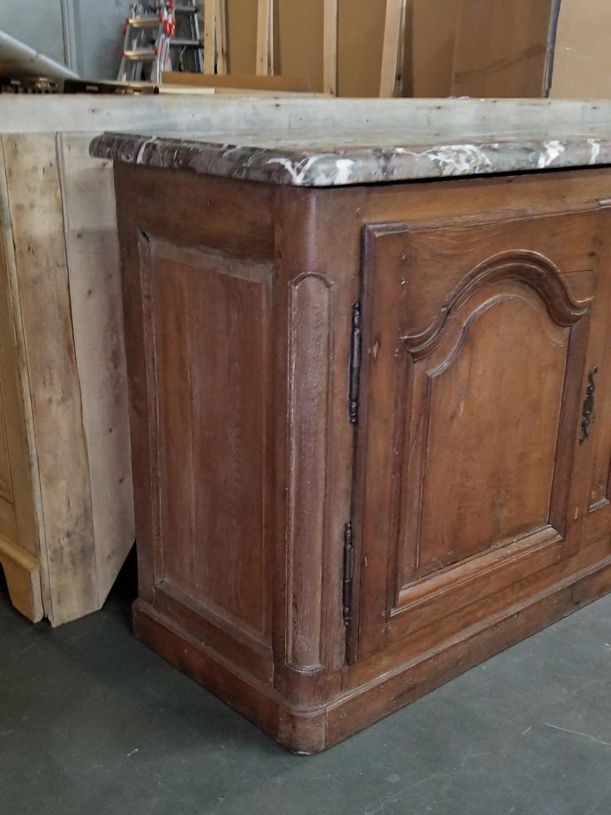 18th-19th century French Louis XV marble-top buffet, mellow finish.