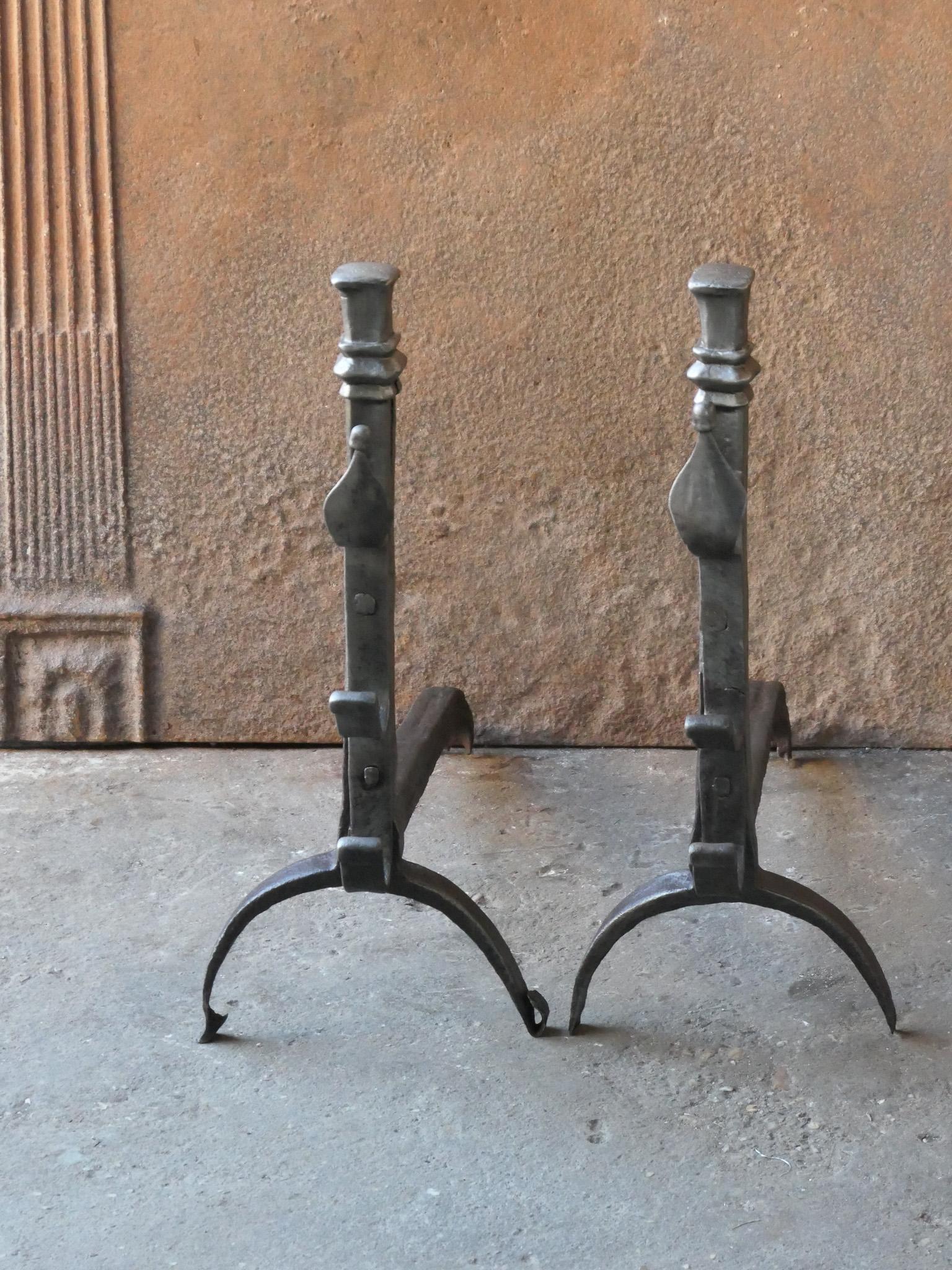 Late 18th or early 19th century French neoclassical period andirons. The andirons are hand forged and made of wrought iron. The condition of the andirons is good.







 