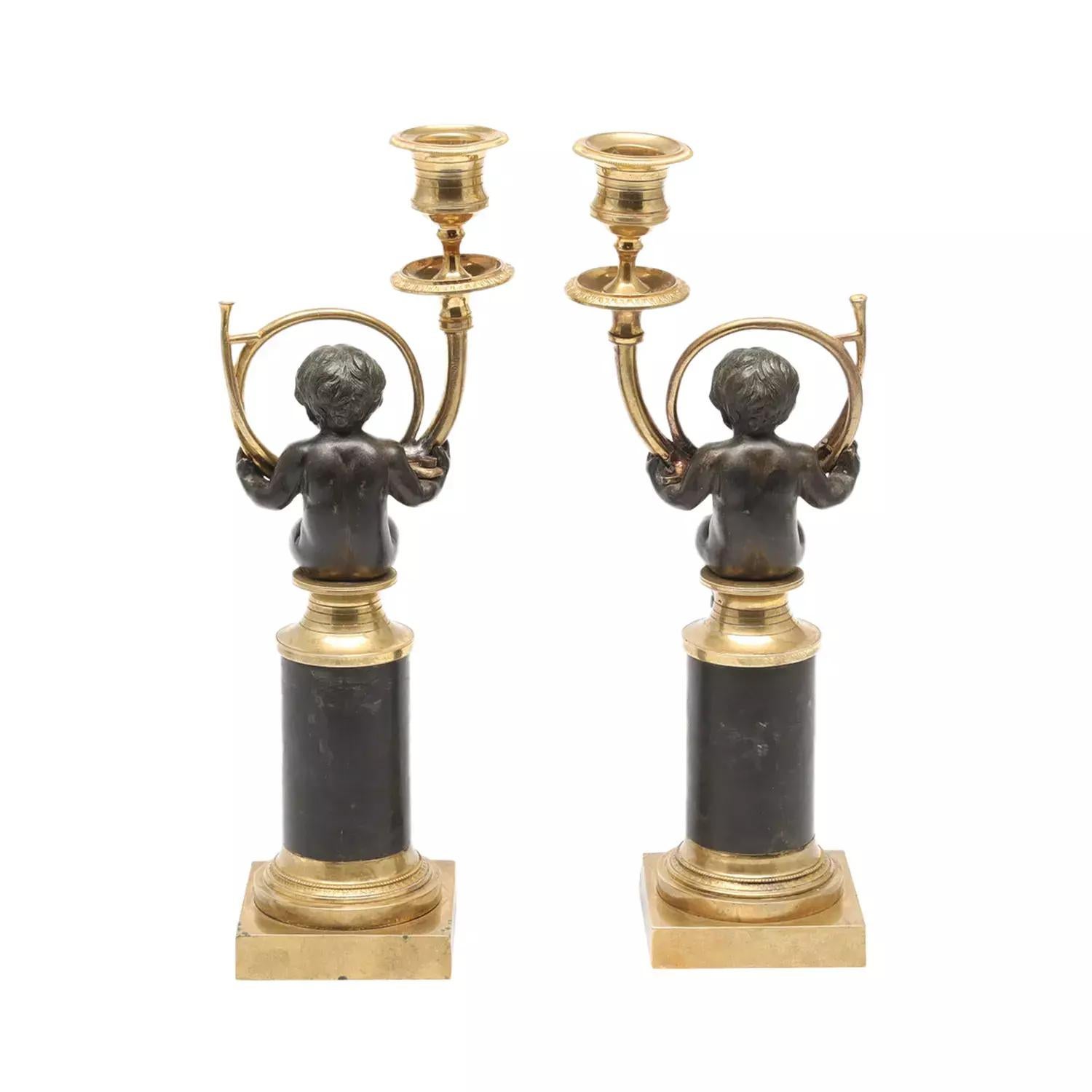 A gold-black, antique French pair of 