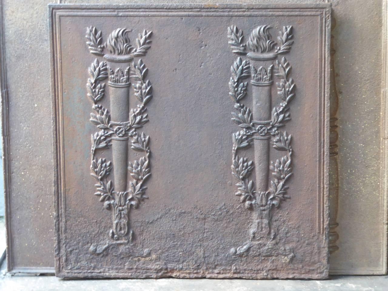 18th-19th century French fireback with two pillars of freedom. The pillars symbolize liberty, one of the three values of the French Revolution (liberté, egalité and fraternité).

We have a unique and specialized collection of antique and used