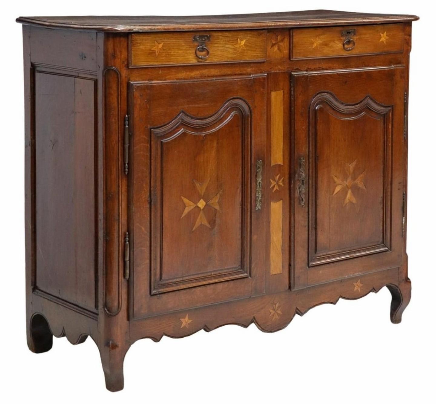 A rare and likely one-of-a-kind rustic country French oak and marquetry enfilade buffet. circa 1775-1825

Born in Provincial France in the late 18th / early 19th century, hand-crafted in elegant Louis XV taste, having a wooden planked top with