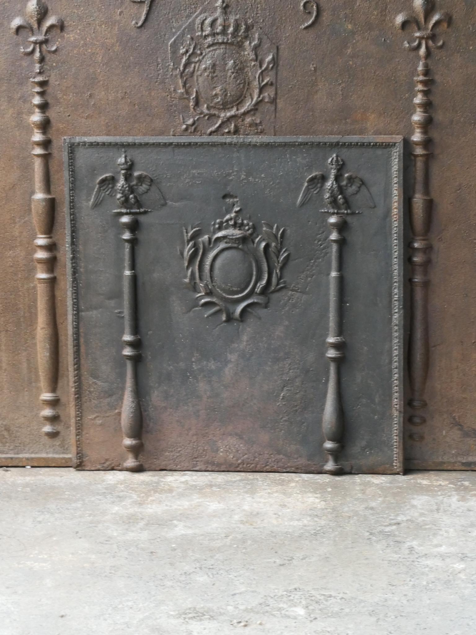 18th-19th century French fireback with two eagles, coat of arms of Napoleon Bonaparte. The style of the fireback is Neoclassical and it is from that period.

The fireback is made of cast iron and has a natural brown patina. Upon request it can be