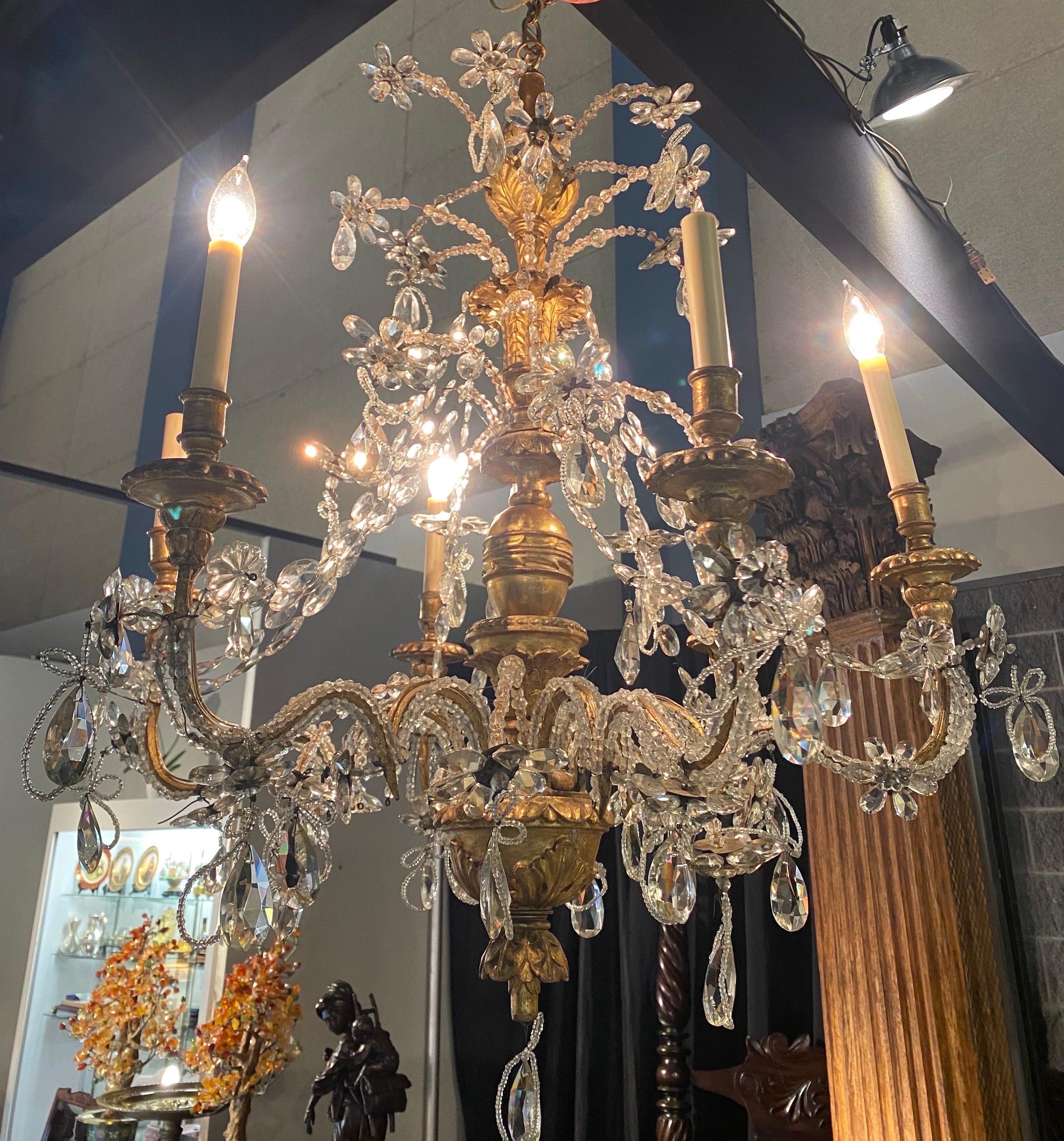Wonderful size and scale on this unique 18th- 19th century Italian giltwood Genovese chandelier with branches of prism flowers
