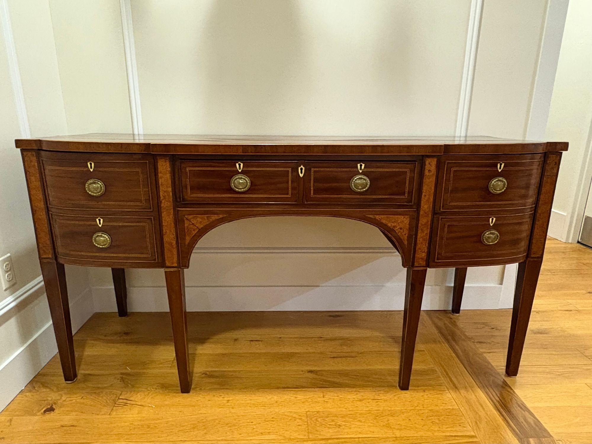 18th / 19th Century George lll Sideboard, Mahogany, Wine Drawer, Inlaid

A very good George III period inlaid mahogany sideboard. Of break fronted form with a central long drawer flanked by a pair of deep drawers (one fitted as a cellarette).