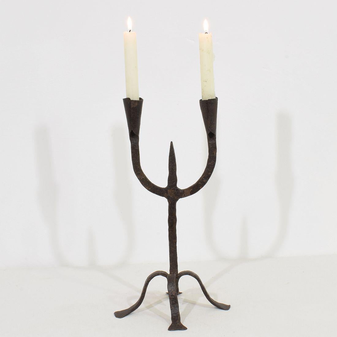 Beautiful 18th-19th century hand forged iron candleholder, Southern France, Spain, 18th-19th century. Weathered.