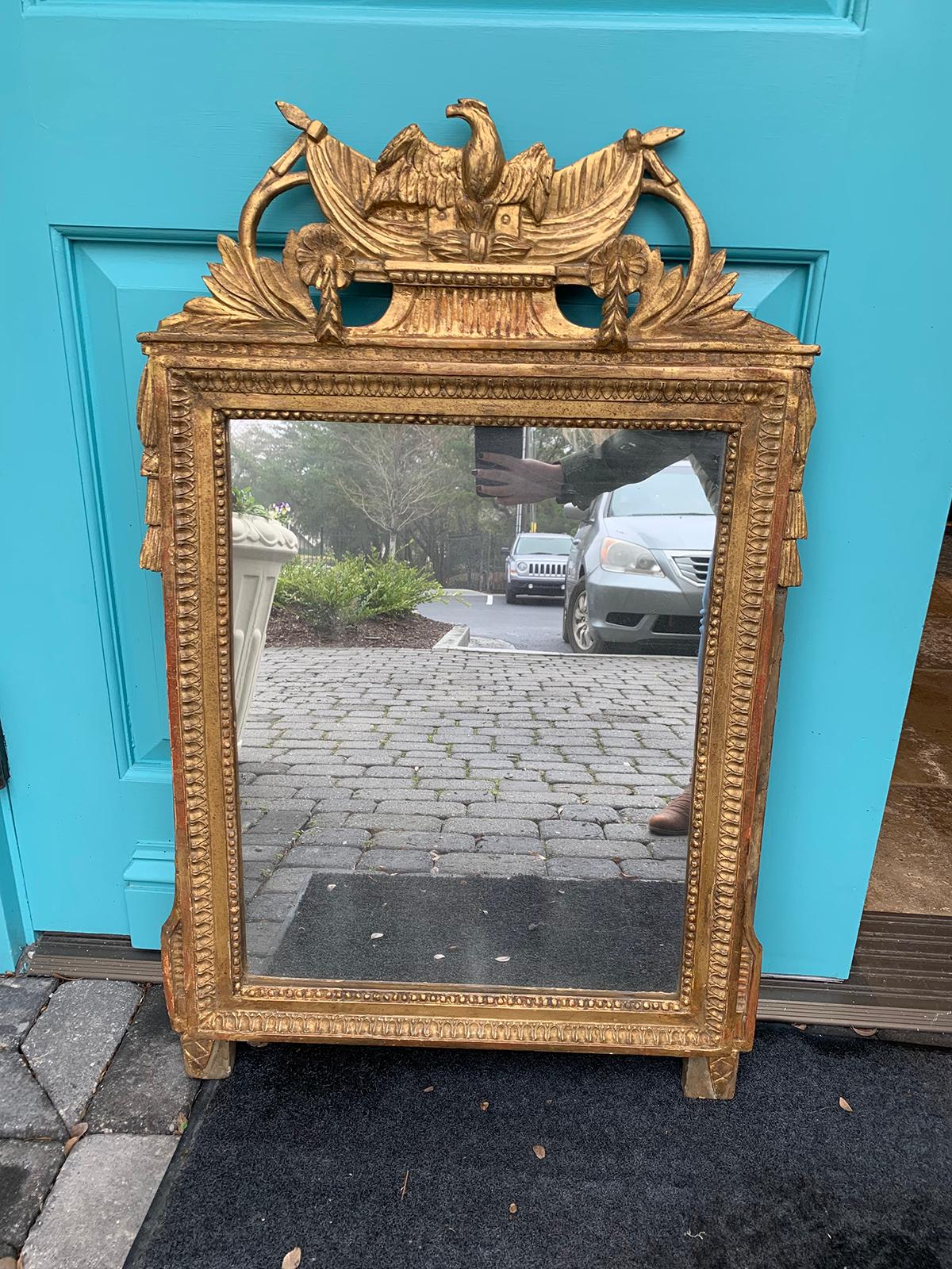 18th-19th century Louis XVI style carved giltwood mirror with eagle.