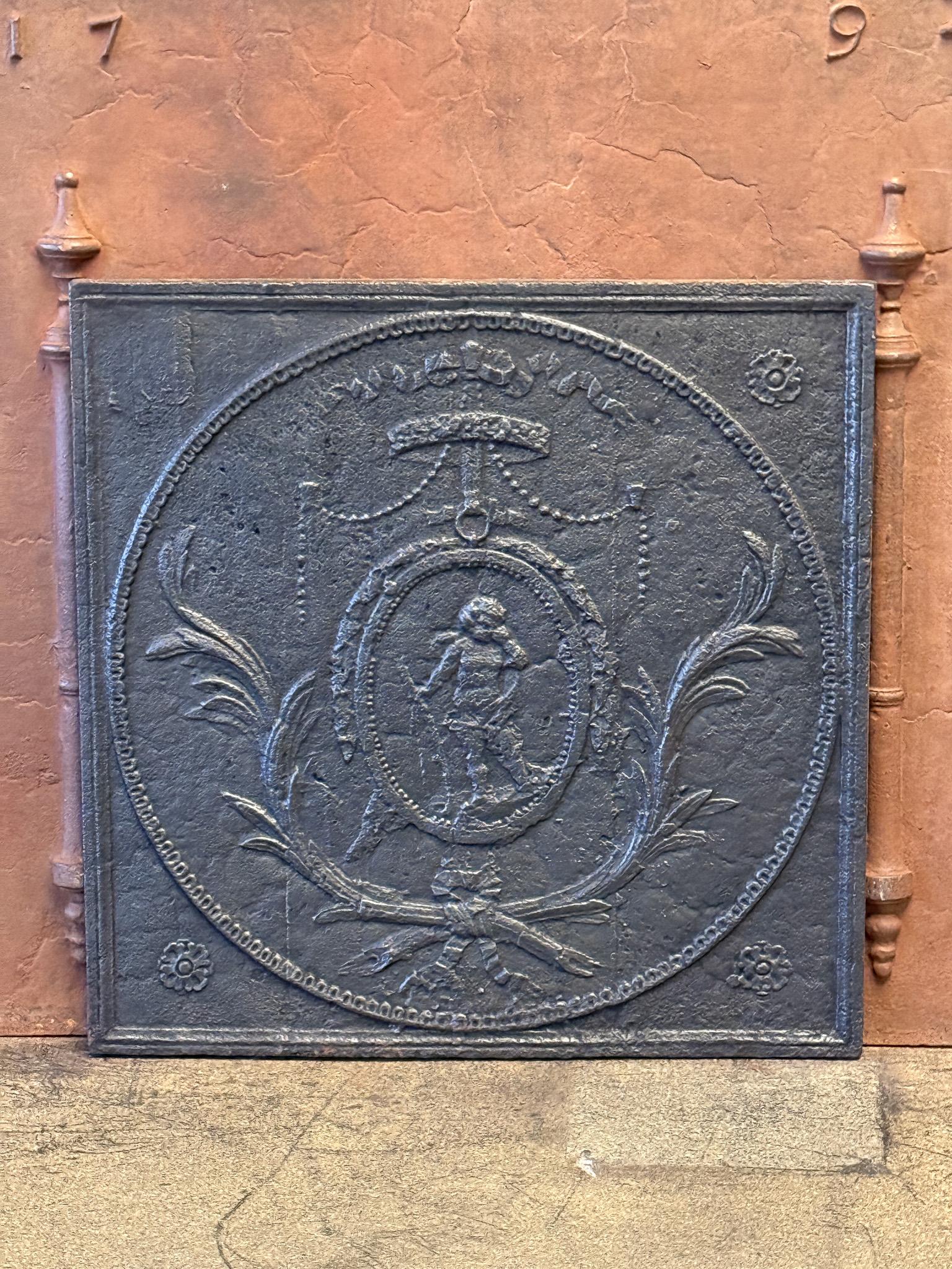 Beautiful 18th/19th Century French Neoclassical Period fireback with a weeping cupid.

The fireback is made of cast iron and has a black/pewter color. The condition is good, no cracks.

This product weighs more than 65 kg / 143 lbs. All our products