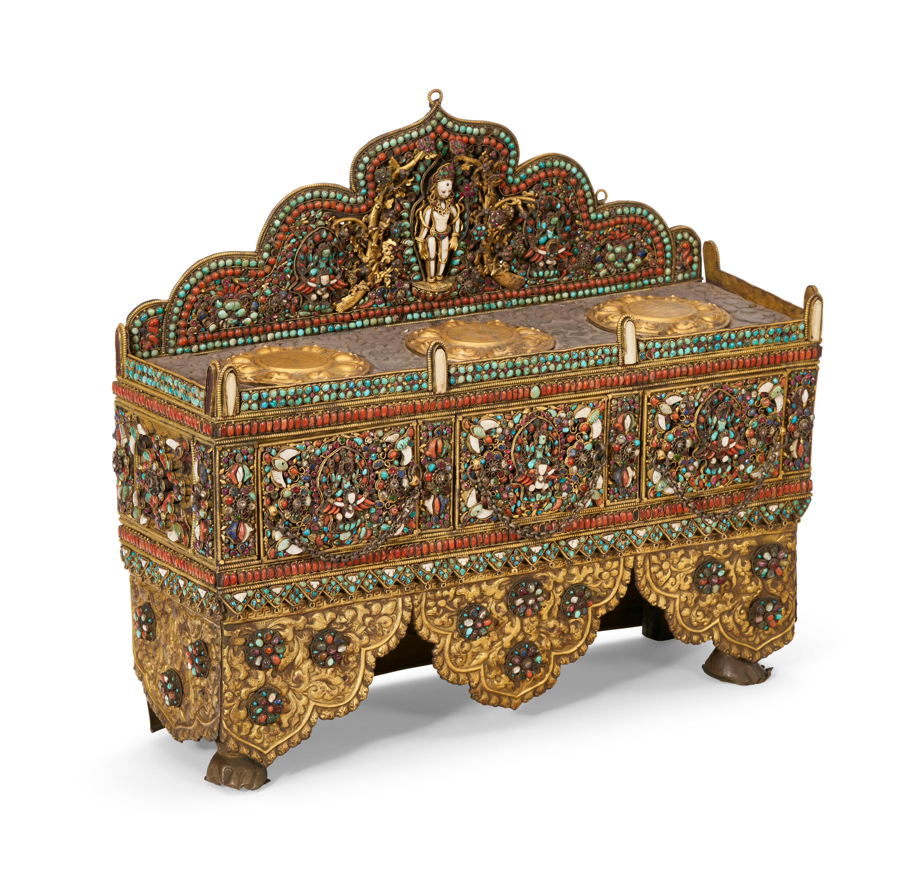Our beautiful antique Hindu altar from Nepal, circa 18th/19th century, is crafted from silver and gilt copper and repousse designs and inlaid with hundreds of stones. It has three drawers and a backplate depicting the god, Vishnu on his mount,