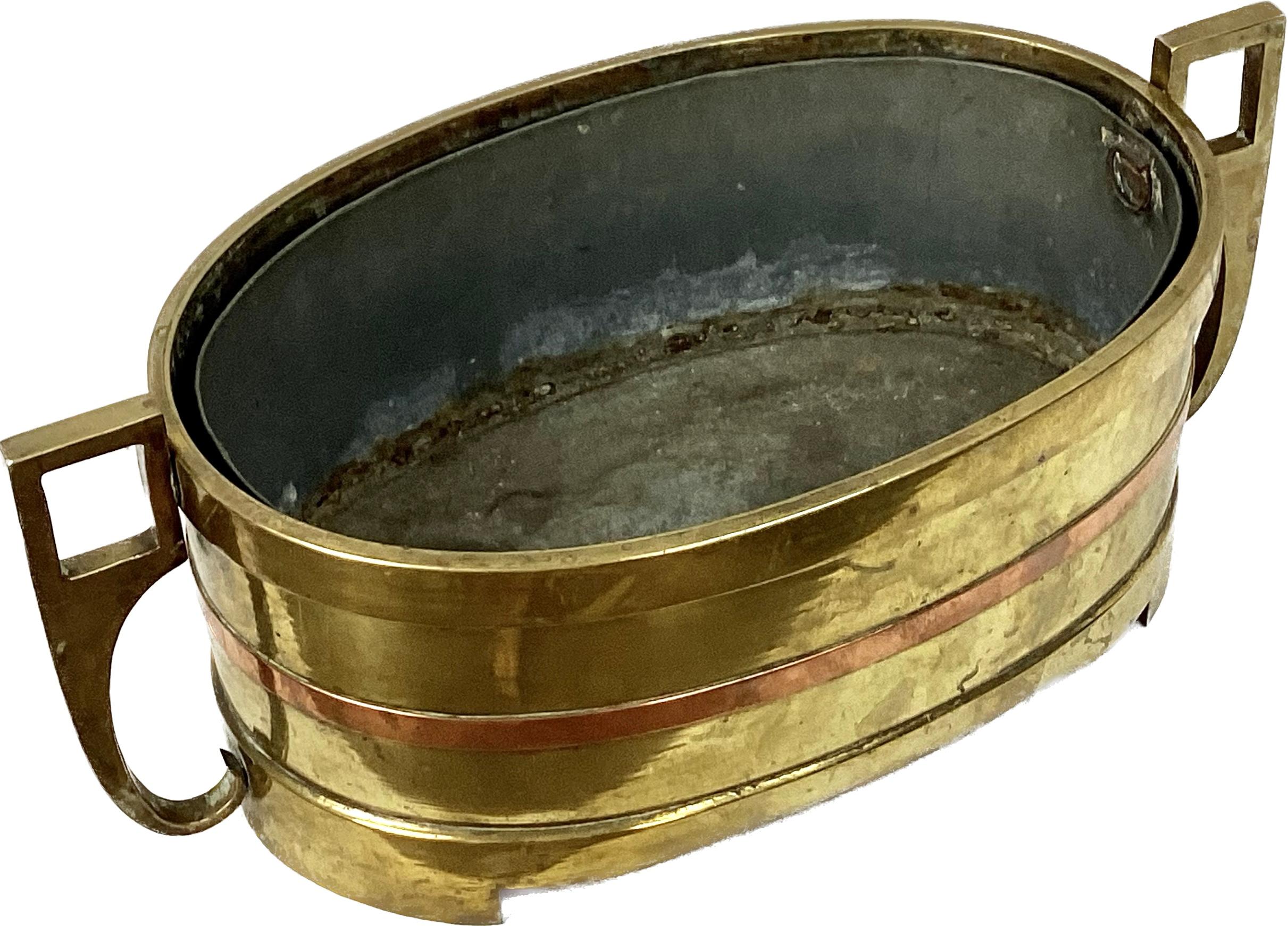 18th / 19th Century Oval Brass Planter with liner, includes band of copper around middle that elevates the look. Has brass handles on either end. Heavy and well made. 