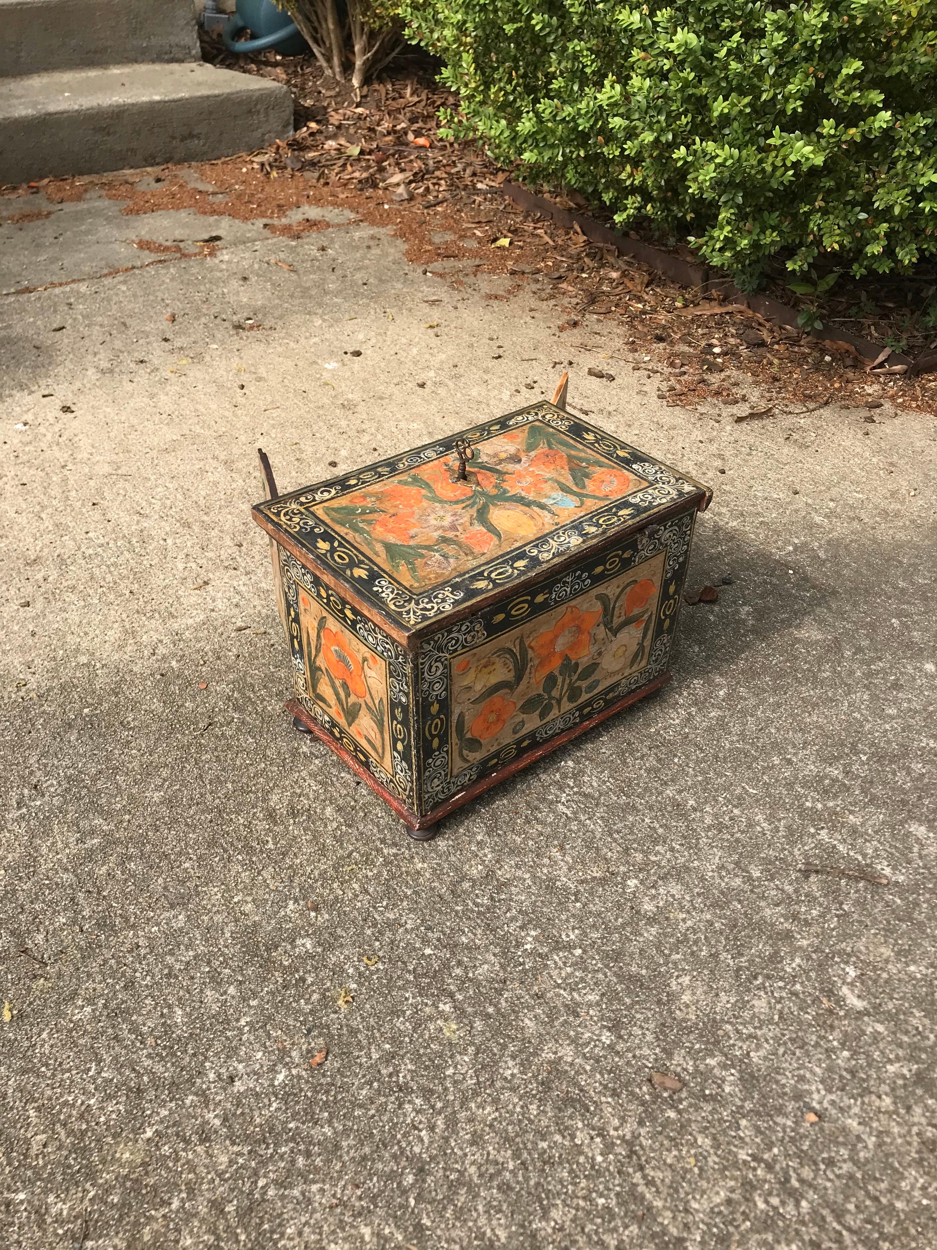 18th-19th century paint decorated continental fitted box. Floral design painted on top and sides with an estate scene painted on both sides of the doors. Doors open to reveal 6 smaller drawers over one large drawer at the bottom. Top opens with