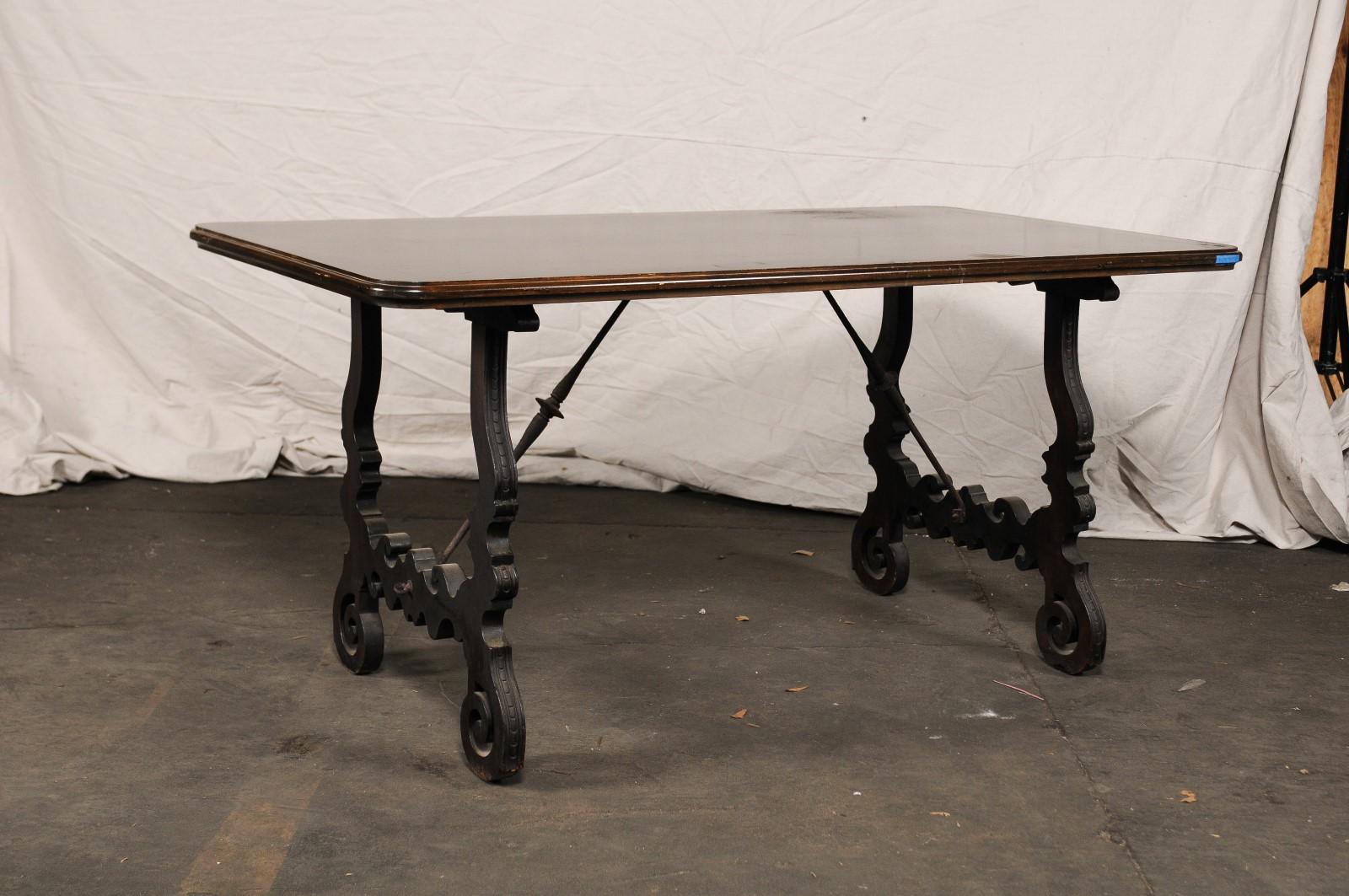 18th-19th century Spanish trestle table with iron stretcher, later parts.