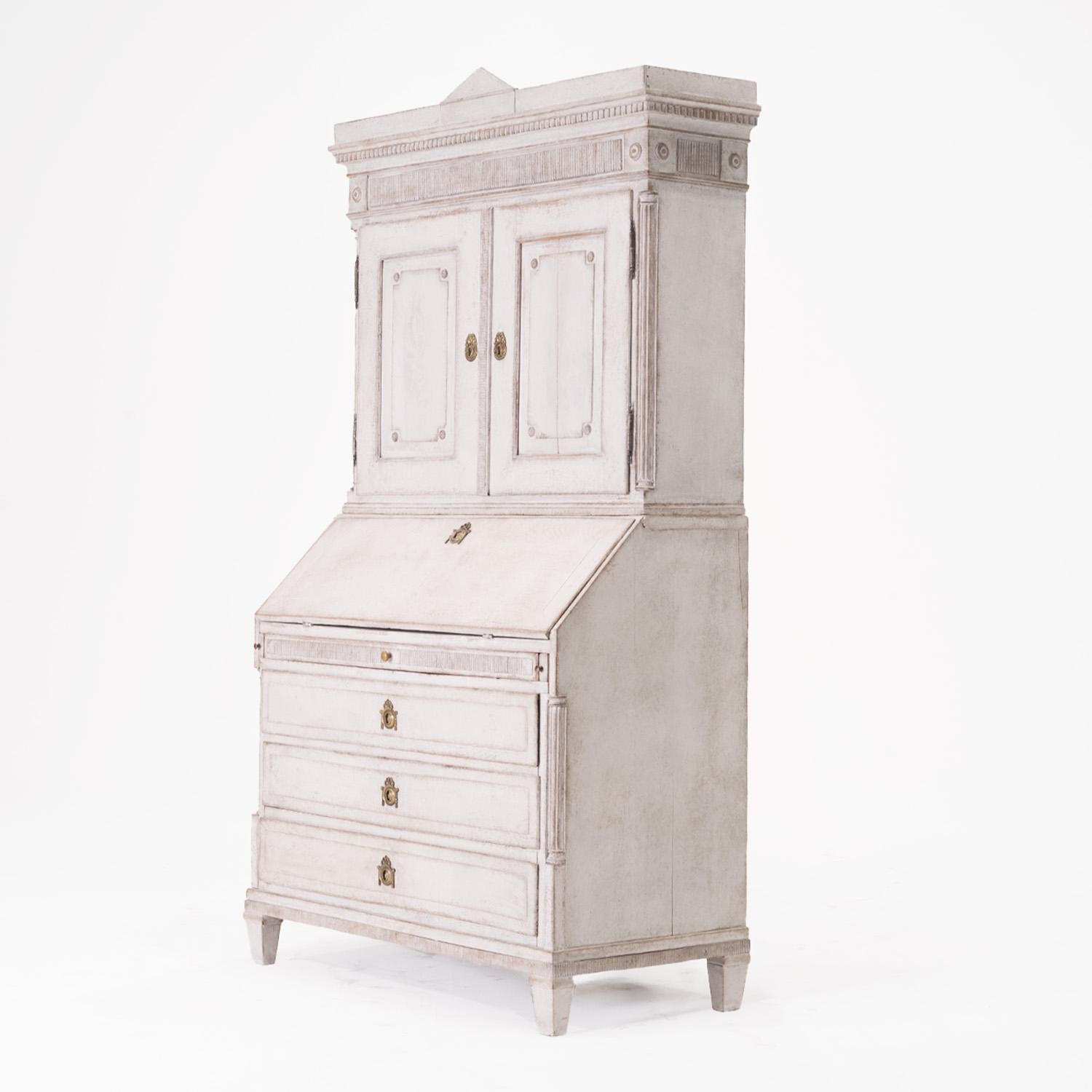 A late 18th-century, antique Swedish Gustavian two-part bureau, meticulously handcrafted in painted pinewood, in good condition. This elegant light-grey secretaire embodies the refined aesthetic of Scandinavian neoclassicism. The upper portion