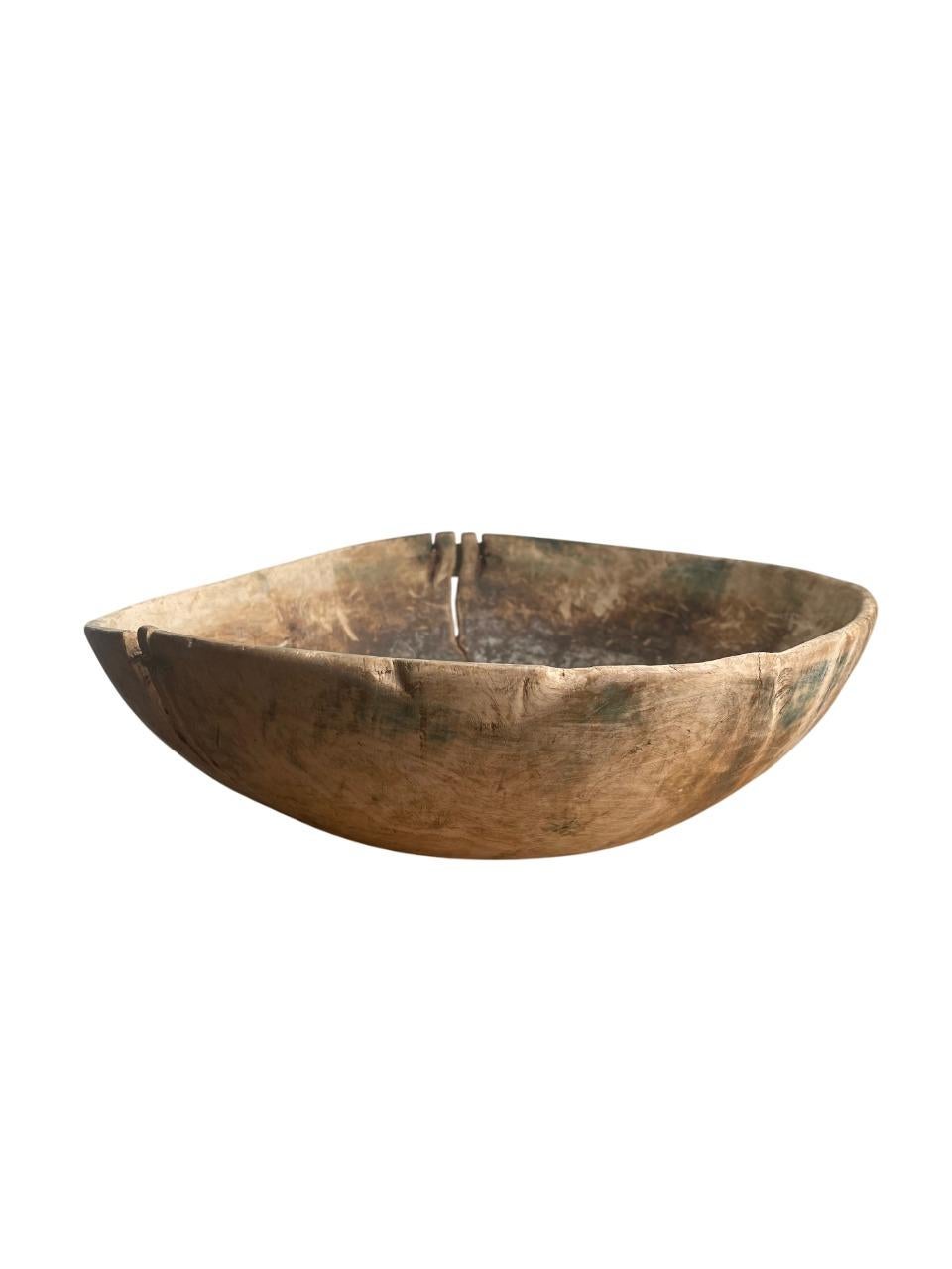 A rare and evocative Swedish hand-carved wooden bowl, dating from the late 18th to early 19th century. Crafted from birch, this rustic vessel embodies the timeless beauty of the wabi-sabi philosophy — embracing imperfection, age, and natural