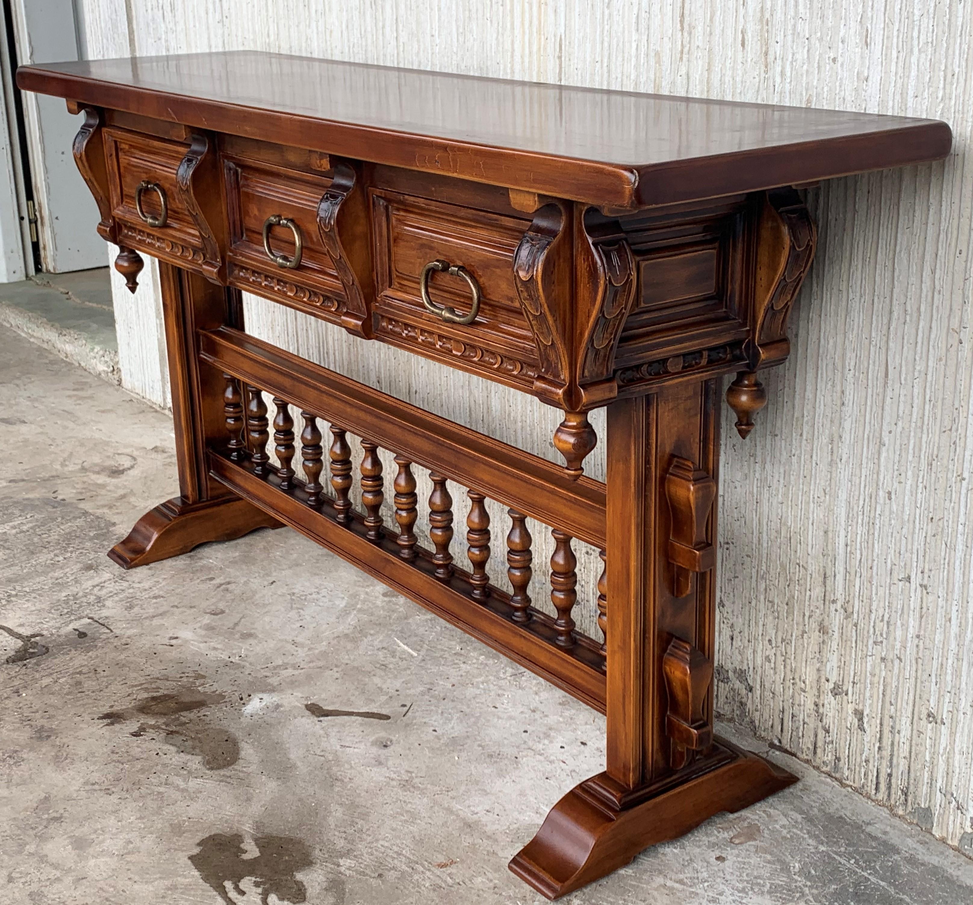 Iron Baroque Console Table in Walnut with Three Carved Drawers and Stretcher For Sale