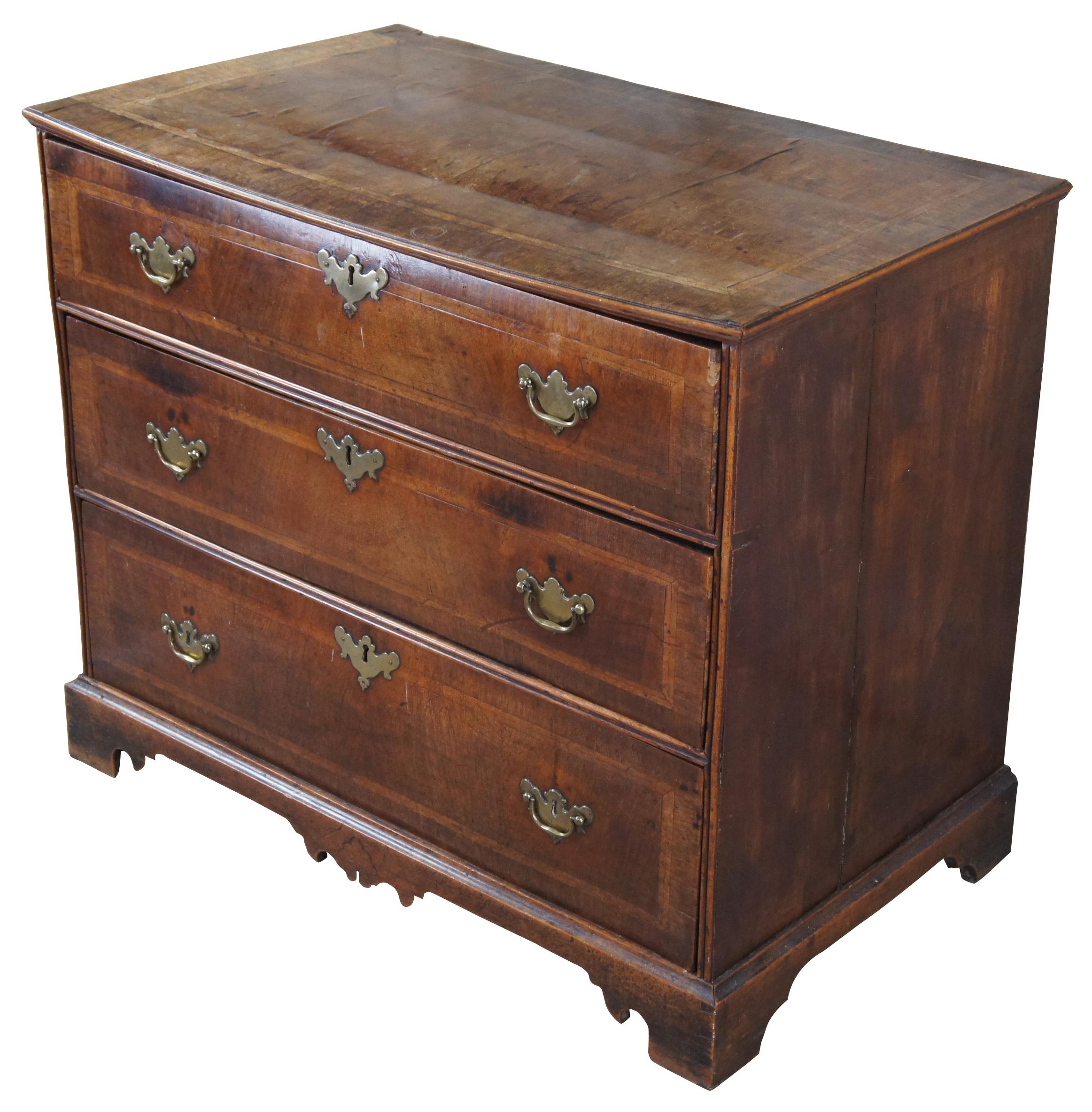 18th century chest George II period chest. Made from mahogany with 3 hand dovetailed drawers featuring rectangular banding and brass hardware. The chest is supported by dovetailed bracket feet.
  