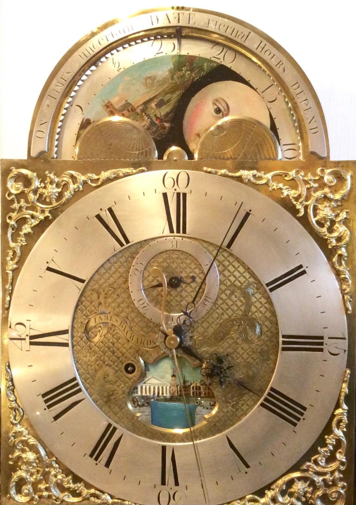 An important rare exceptional inlaid mahogany antique Georgian 18th century longcase grandfather clock by iames richards liverpool featuring rolling moon, an alarm and ferguson tidal dial.
The stunning case is veneered in best quality flame