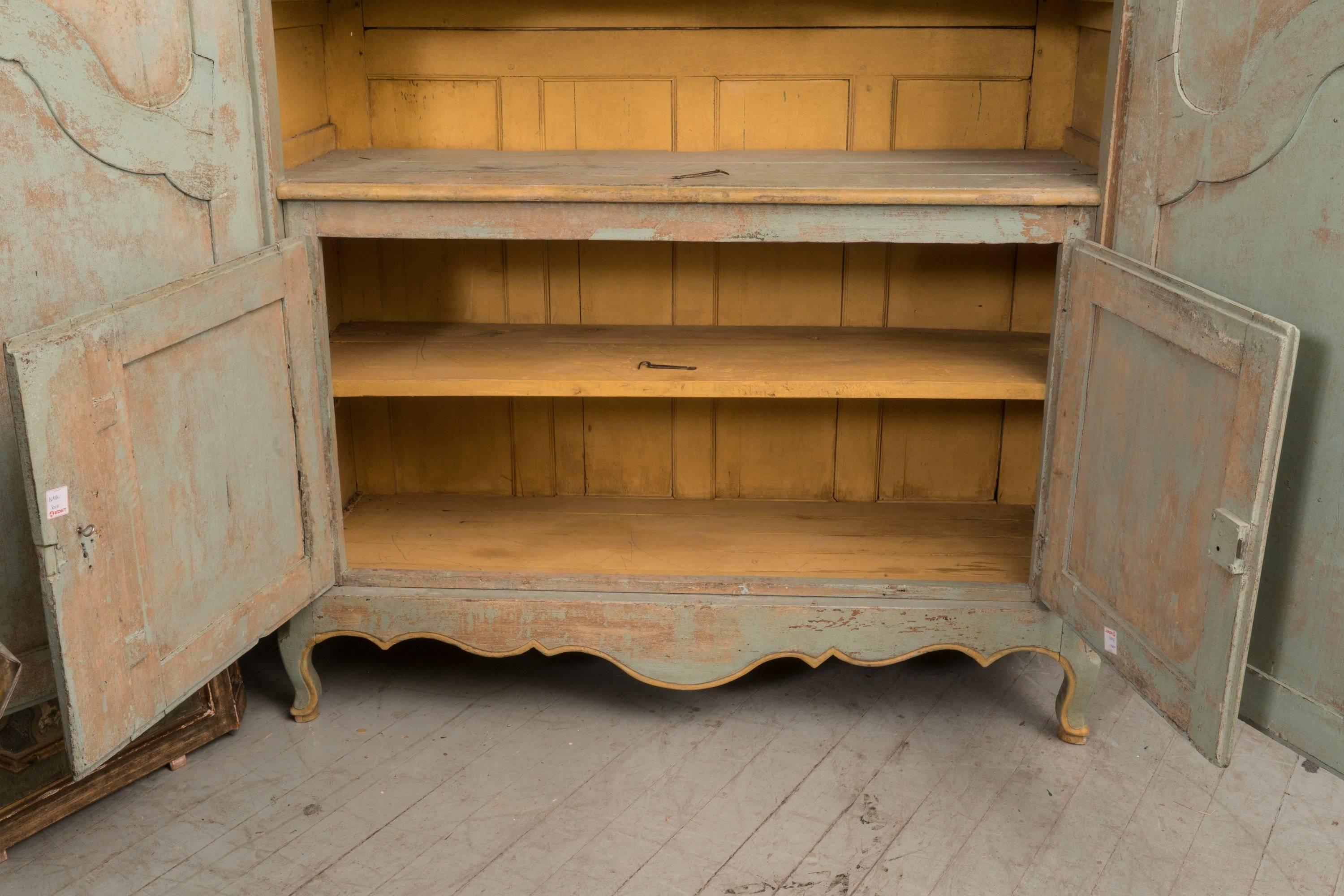 This is a very rare Bordelaise Armoire with an interior buffet. Original paint with a beautiful patina.