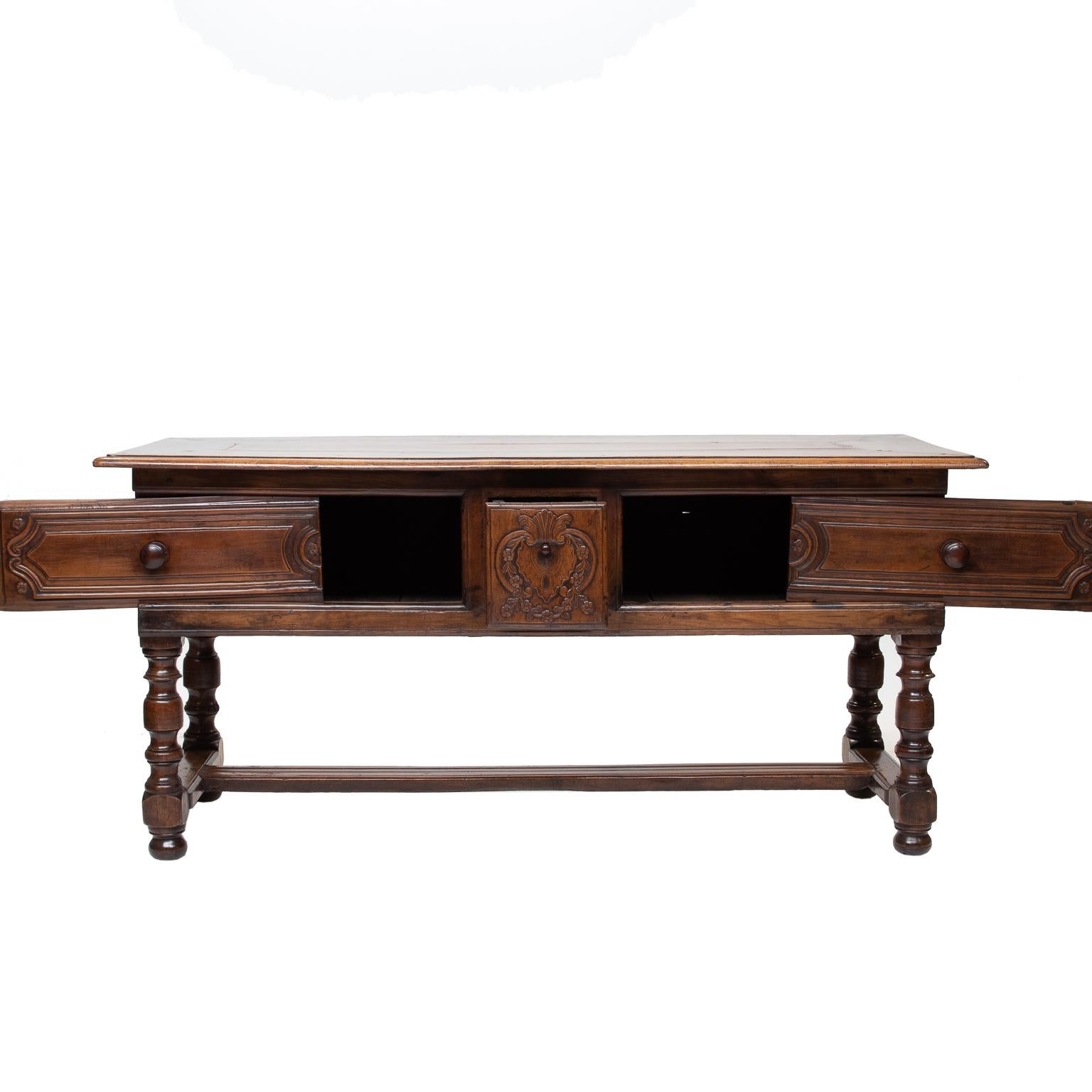 18th century Breton cherrywood dressing table with sliding front surrounding a center drawer. Turned legs with an H-stretcher. Very nice quality table. Finished on all sides. Great for a console, sofa table, or float in a room.