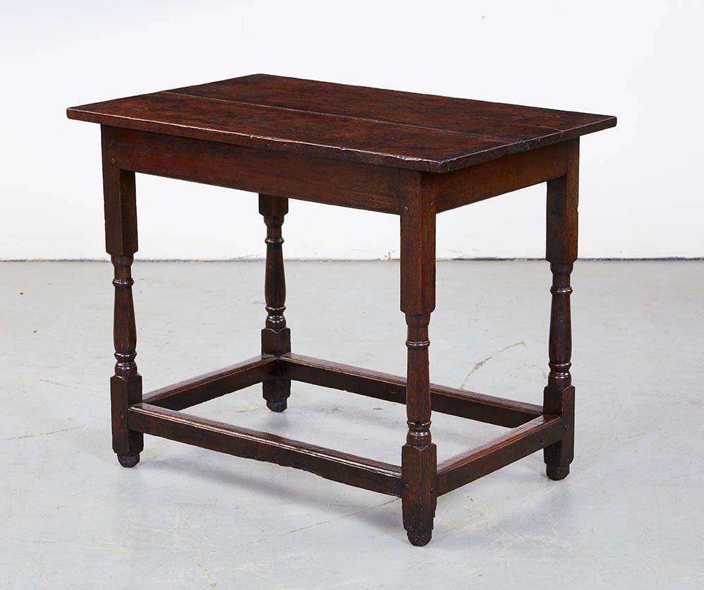 An early 18th century English table with stunning rectangular burl oak top over straight apron base on simple baluster turned legs joined by low box stretcher. Finished on all four sides and having great color and form.